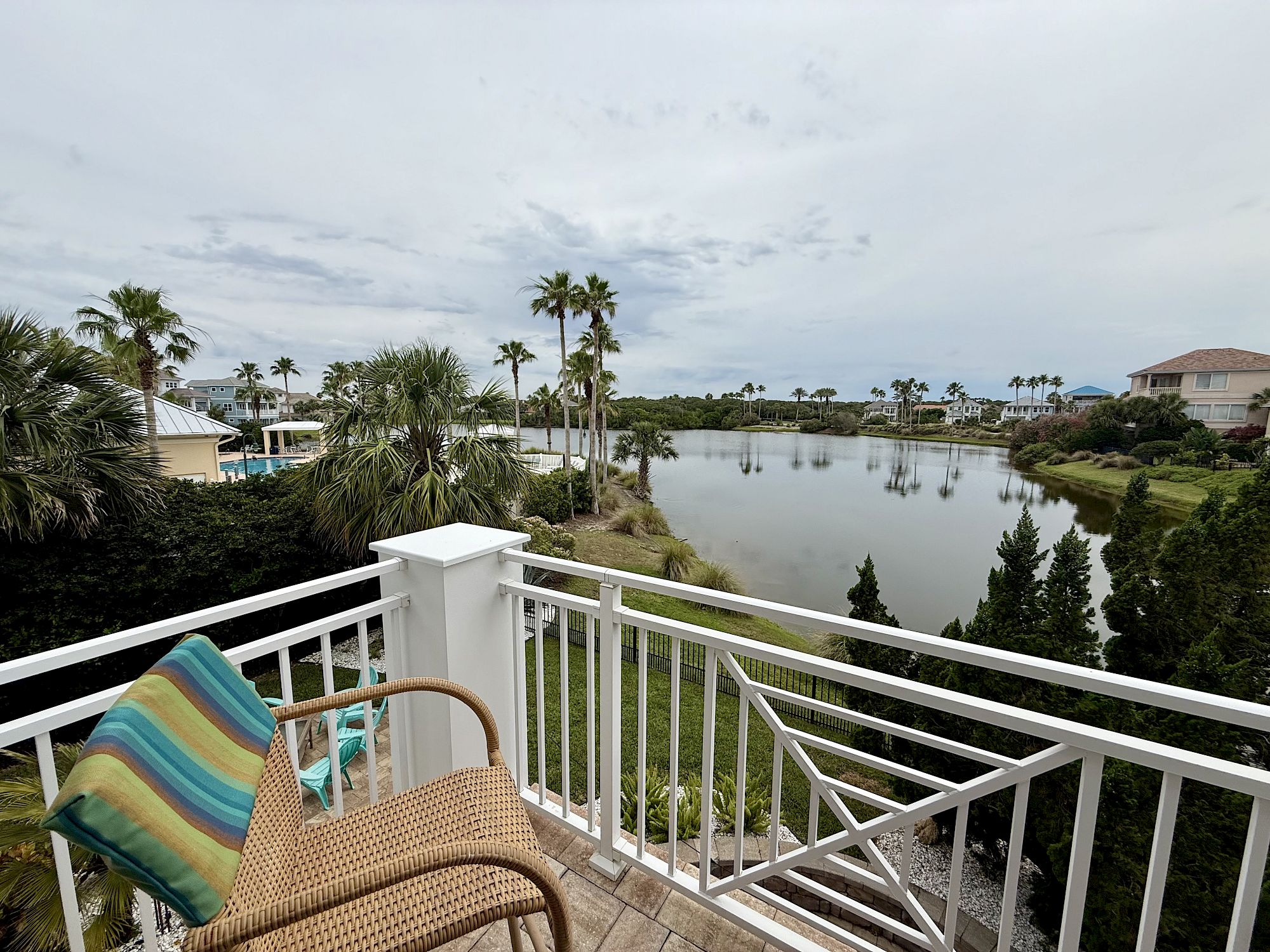 image Balcony with two chairs and open water views — a good spot to take in the coastal air