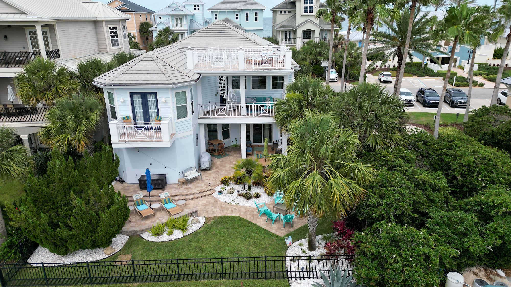 image Exterior view of the home with outdoor seating and lush landscaping on multiple levels