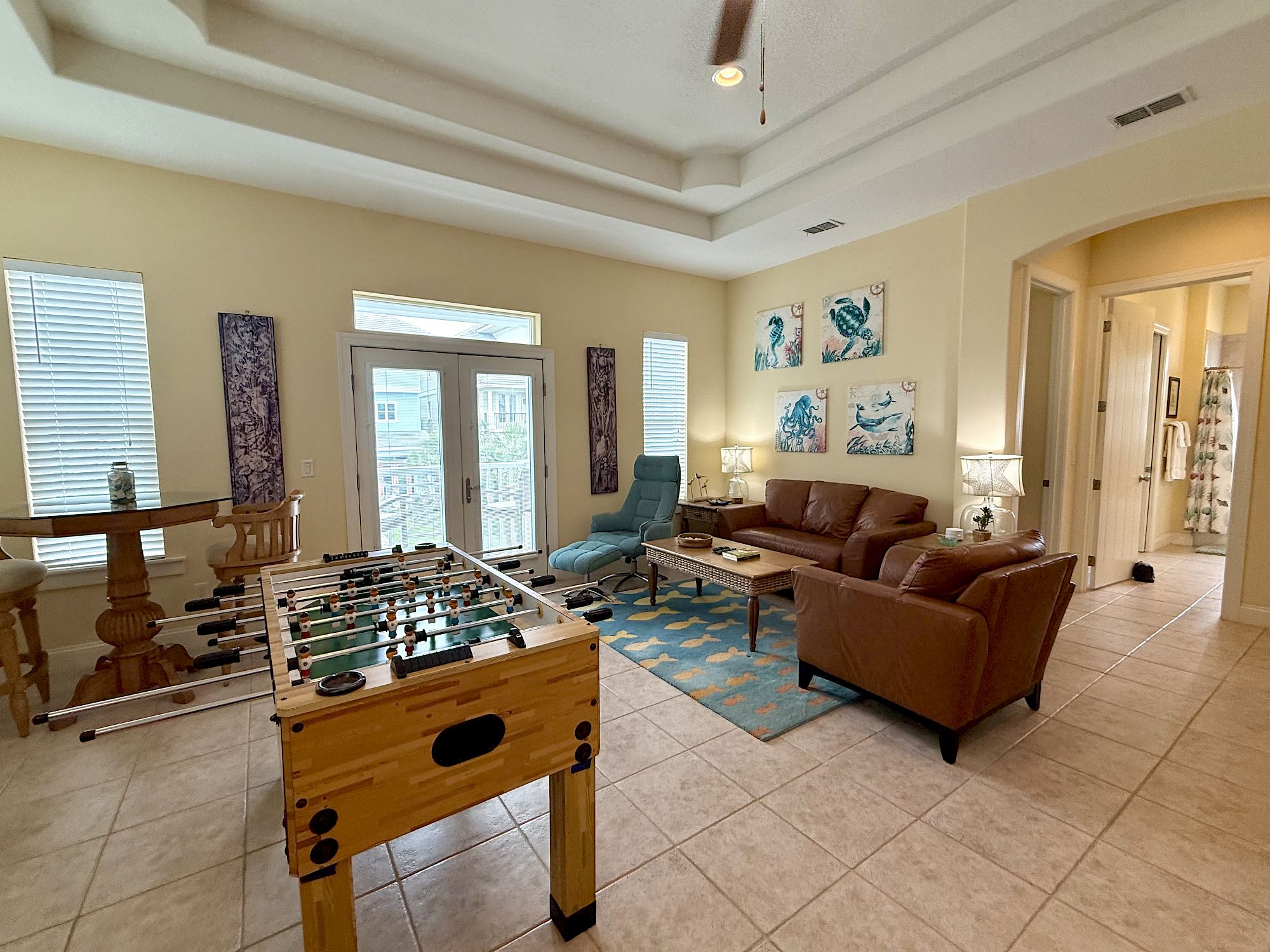 image Game room with foosball table and casual seating — a fun option for a rainy afternoon