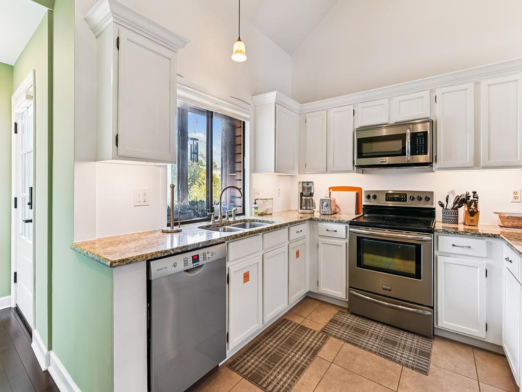 image Cook up your favorites in this airy kitchen with full appliances and plenty of counter space