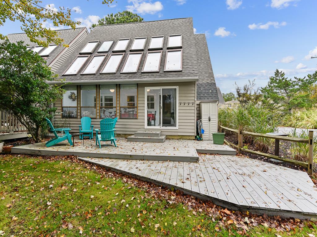 image Deck and three-season porch side by side -- unwind in the screened porch or fire up the gas BBQ after a beach day