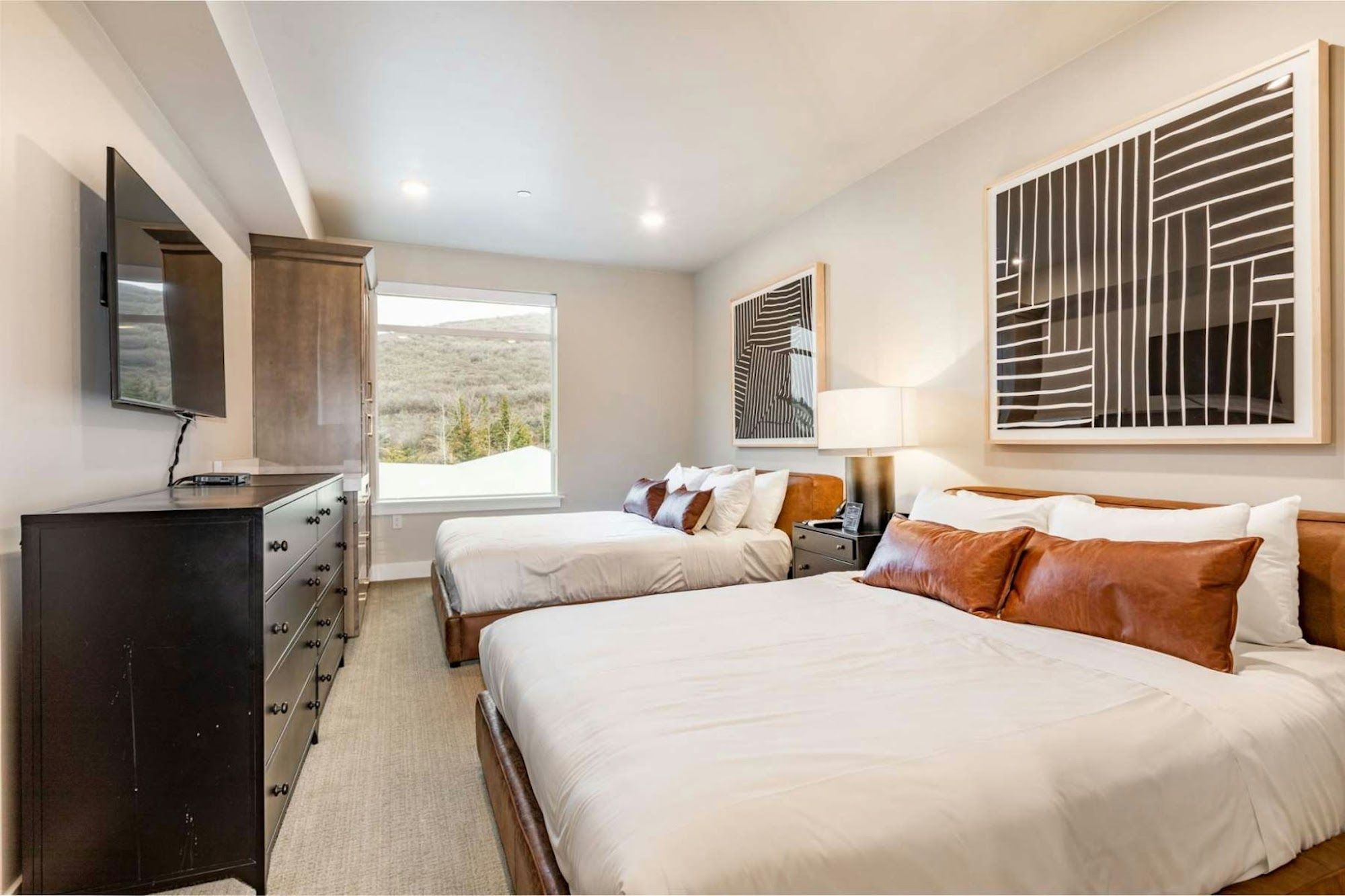 image Bedroom with two queen beds and mountain view through large window