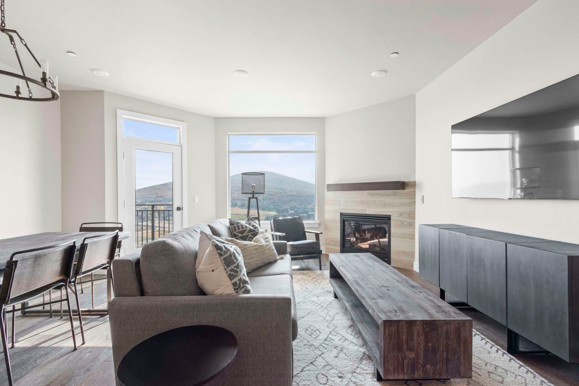 image Living room with fireplace, mountain views, and large sofa