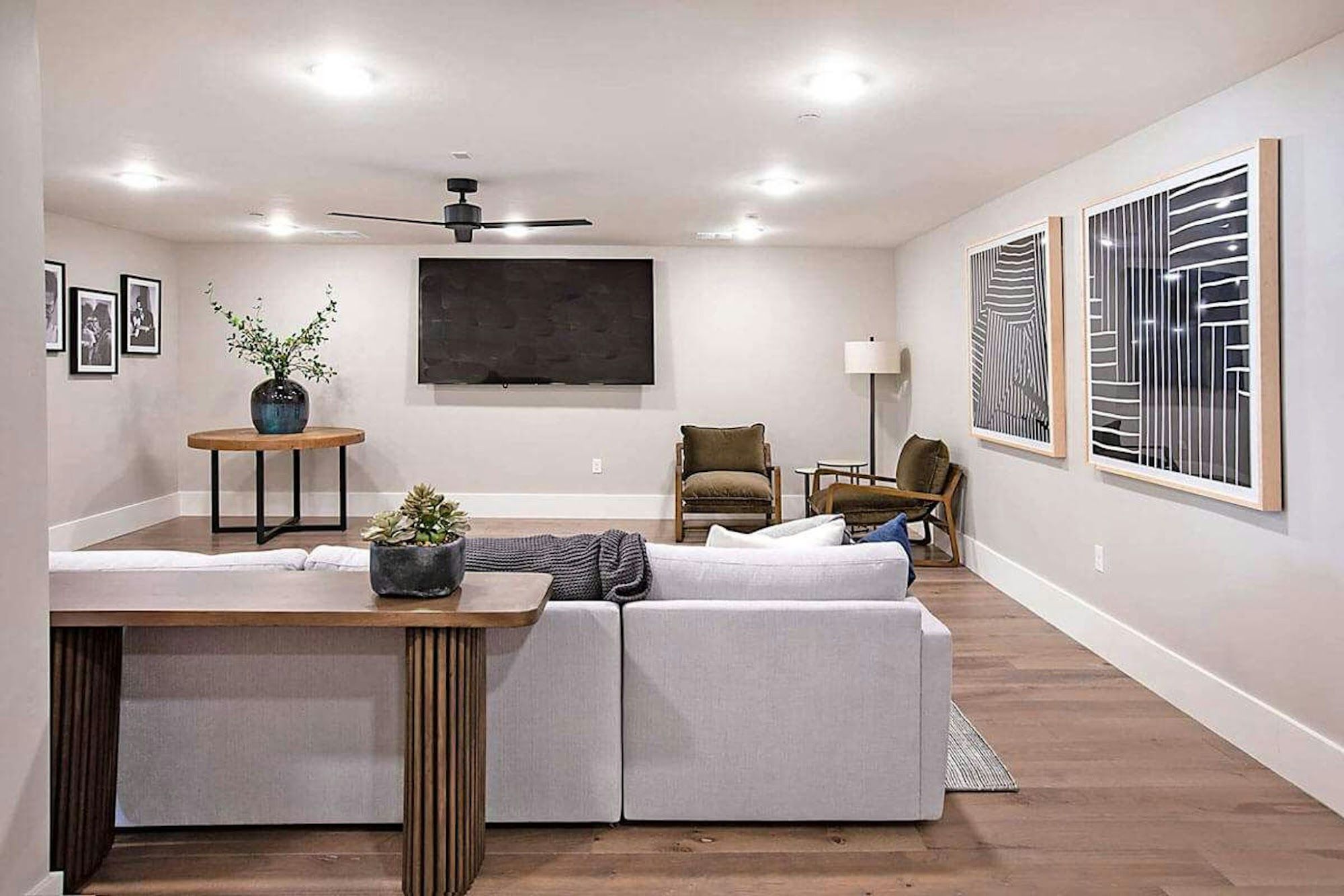 image Spacious lounge with sectional seating and wall-mounted TV