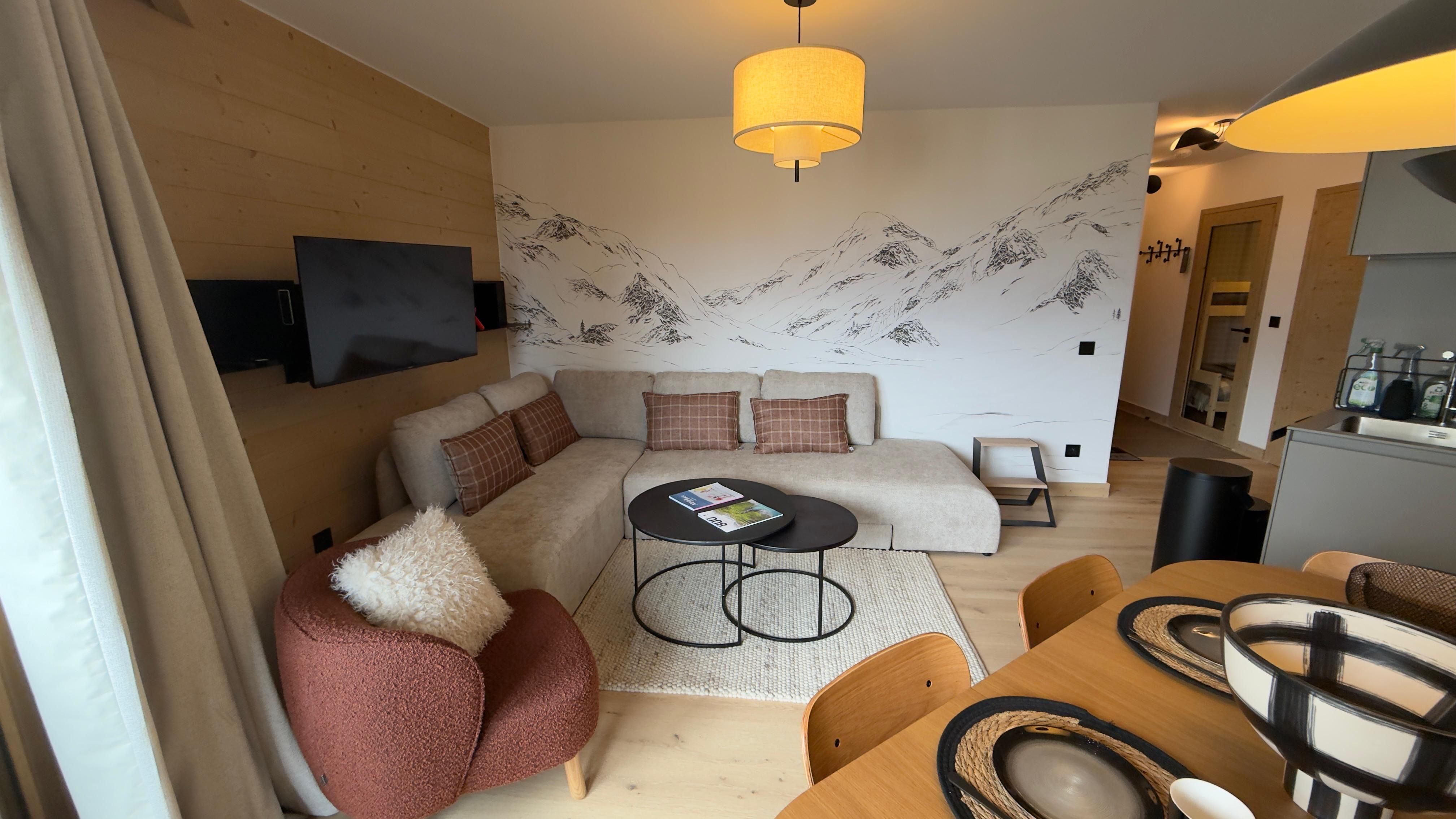 image Just steps from this dining table, the open-plan kitchen keeps a Nespresso machine and raclette set ready for nights in