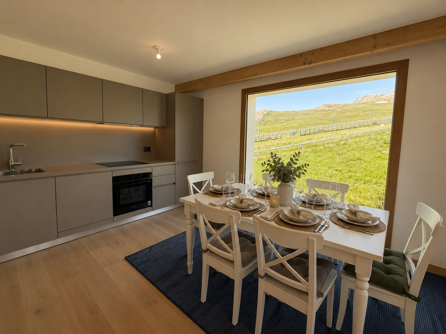 image Prepare meals with mountain views, then gather around the dining table to share them.