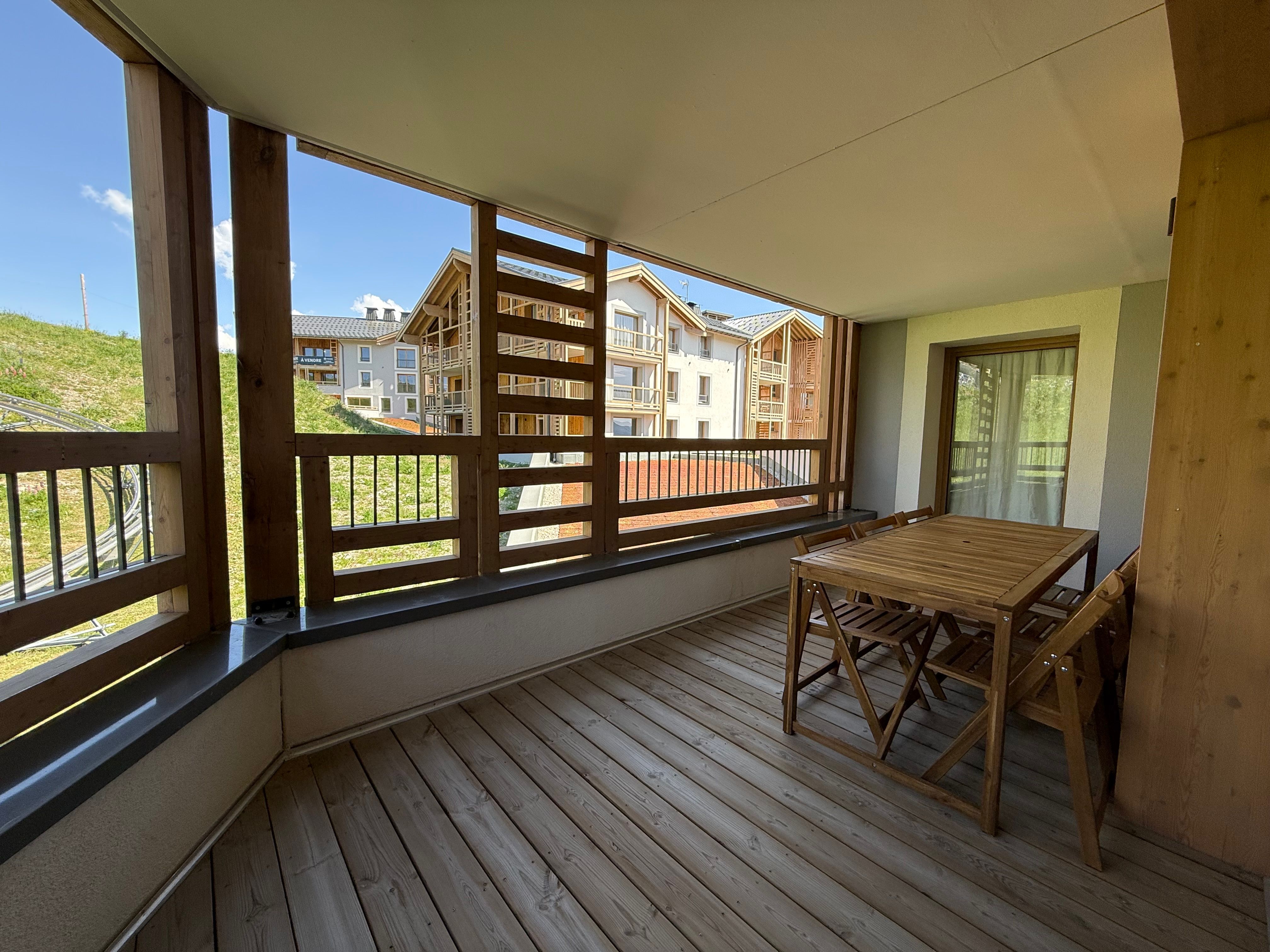 image Breakfast on this covered terrace looks out over the village, with the Palais des Sports' two heated pools a short walk away.
