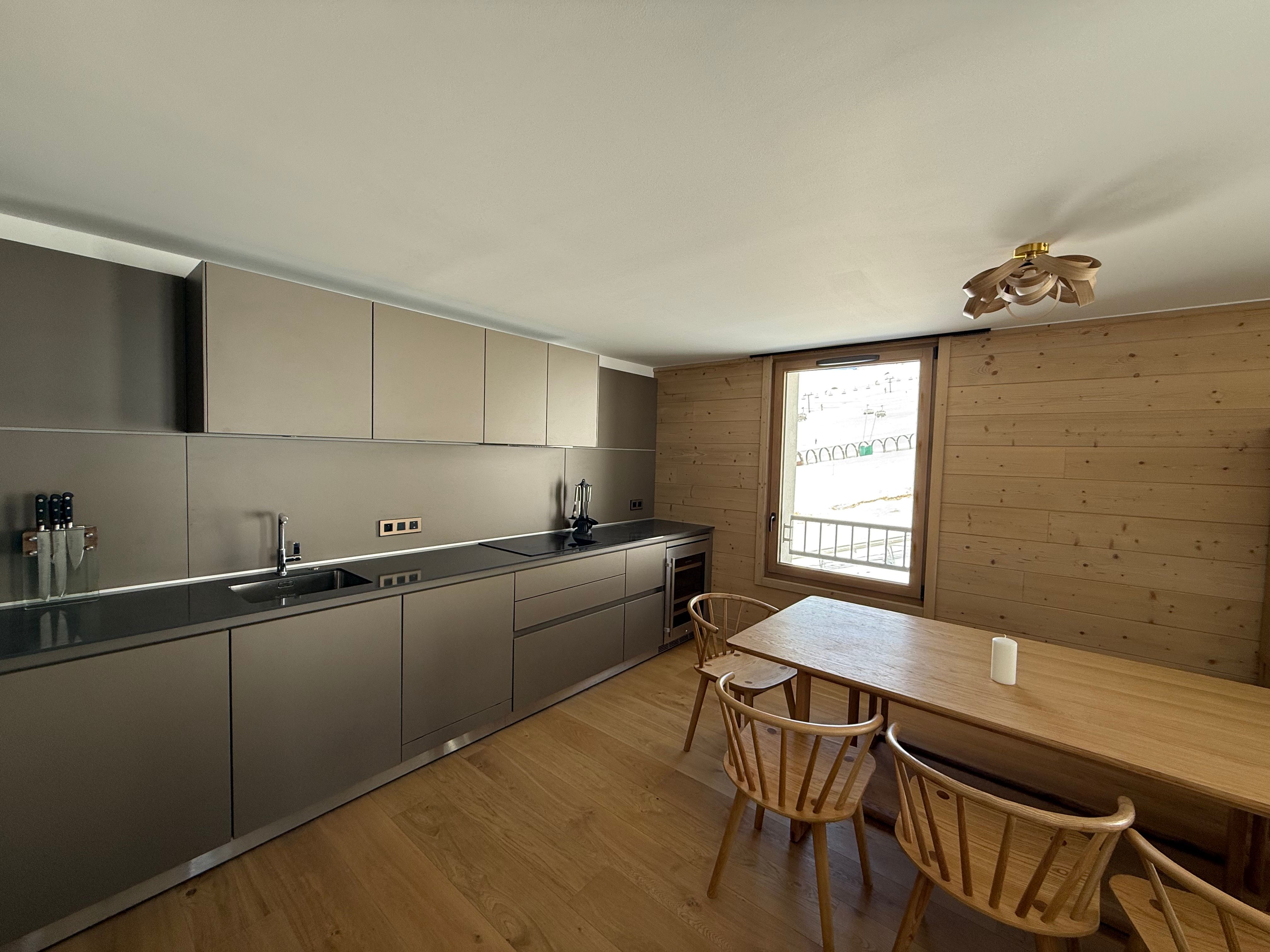 image Prepare meals with mountain views from the kitchen, then gather everyone around the long dining table to share them.