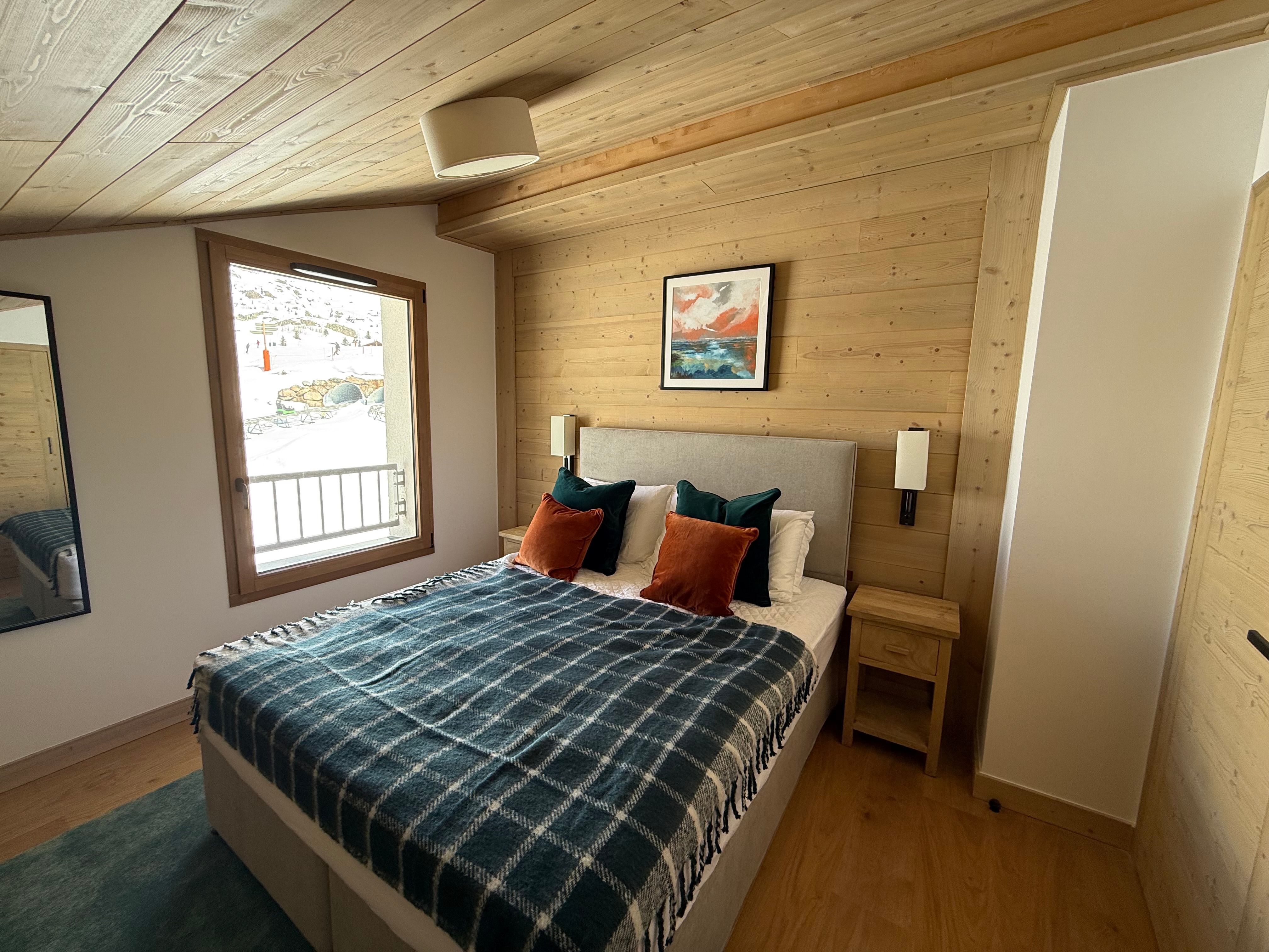 image Wake up to views of the pistes from this peaceful bedroom, perfect for planning another day on the mountain.