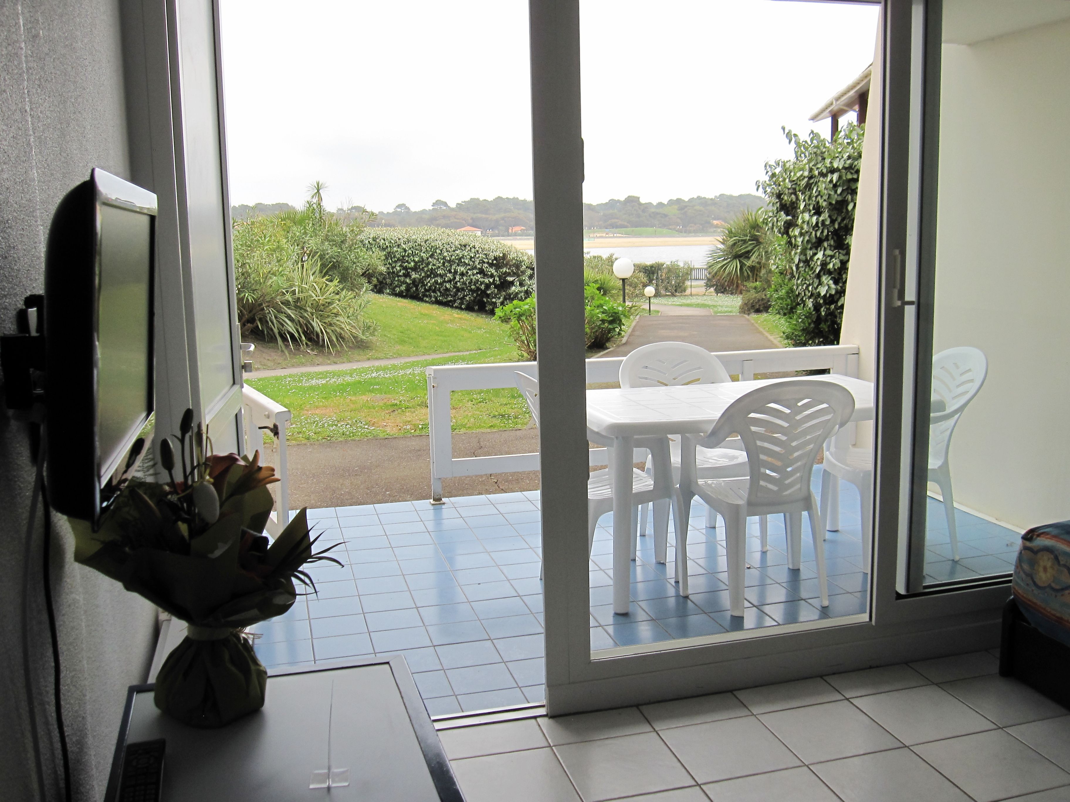 image After a morning by the lake, these balcony doors open onto a quiet spot to unwind.