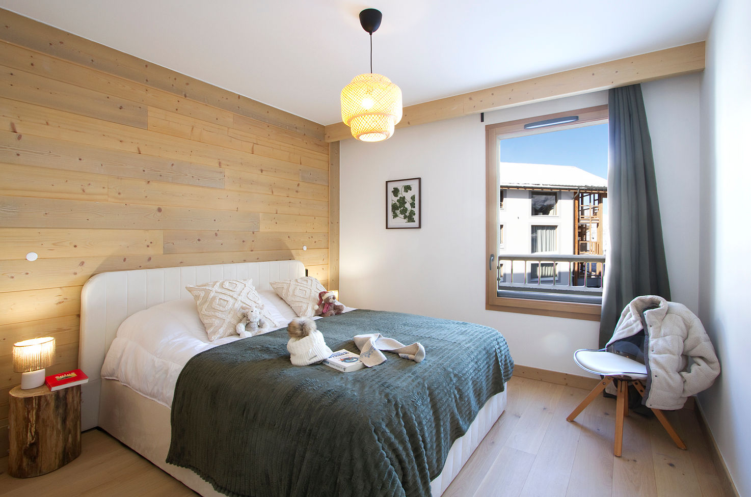 image Wood-panelled walls frame the double bed, ready for a rest after a day on the pistes.