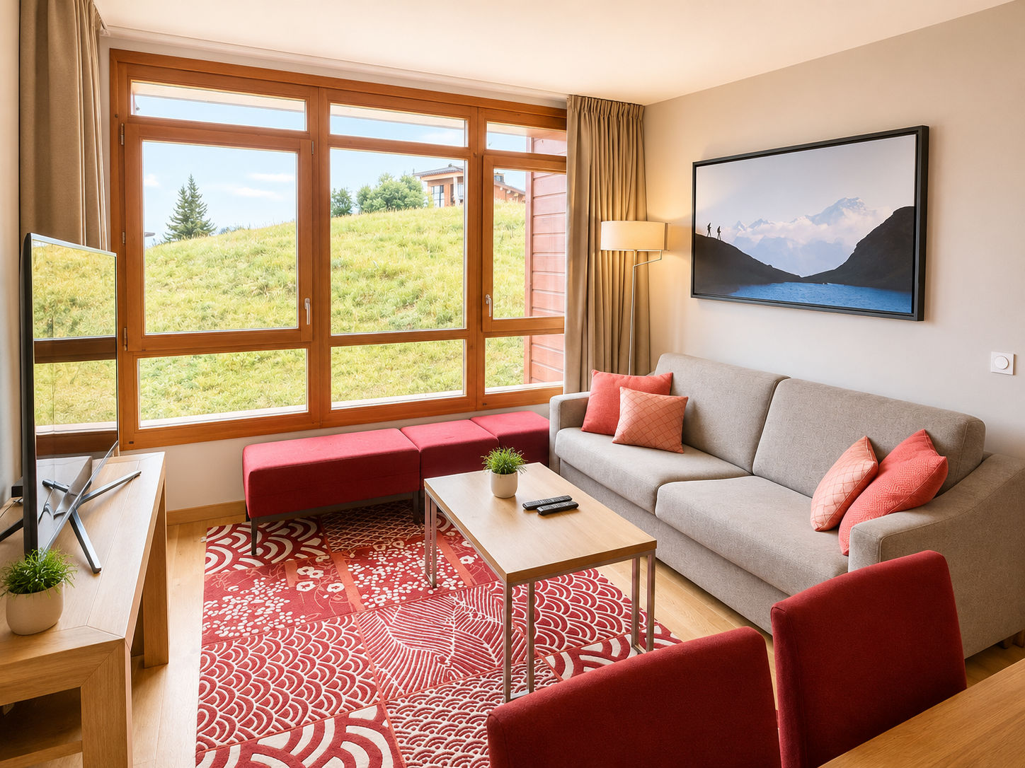 image Chalet-style living space with red patterned rug and mountain view