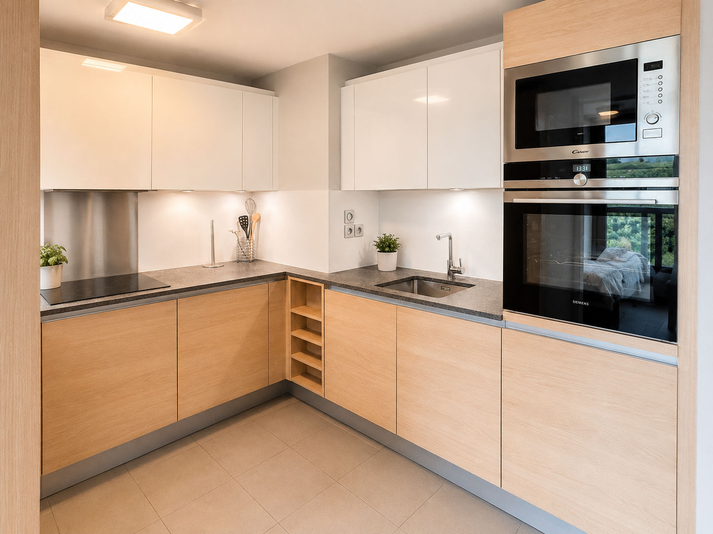 image Sleek fitted kitchen with built-in oven, microwave, and induction hob