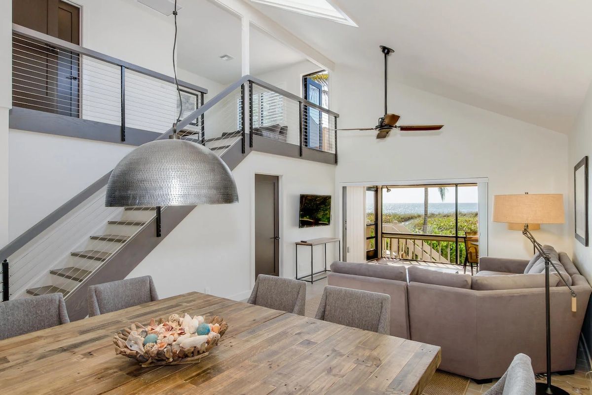 image Dining and living areas share one open space for gathering.