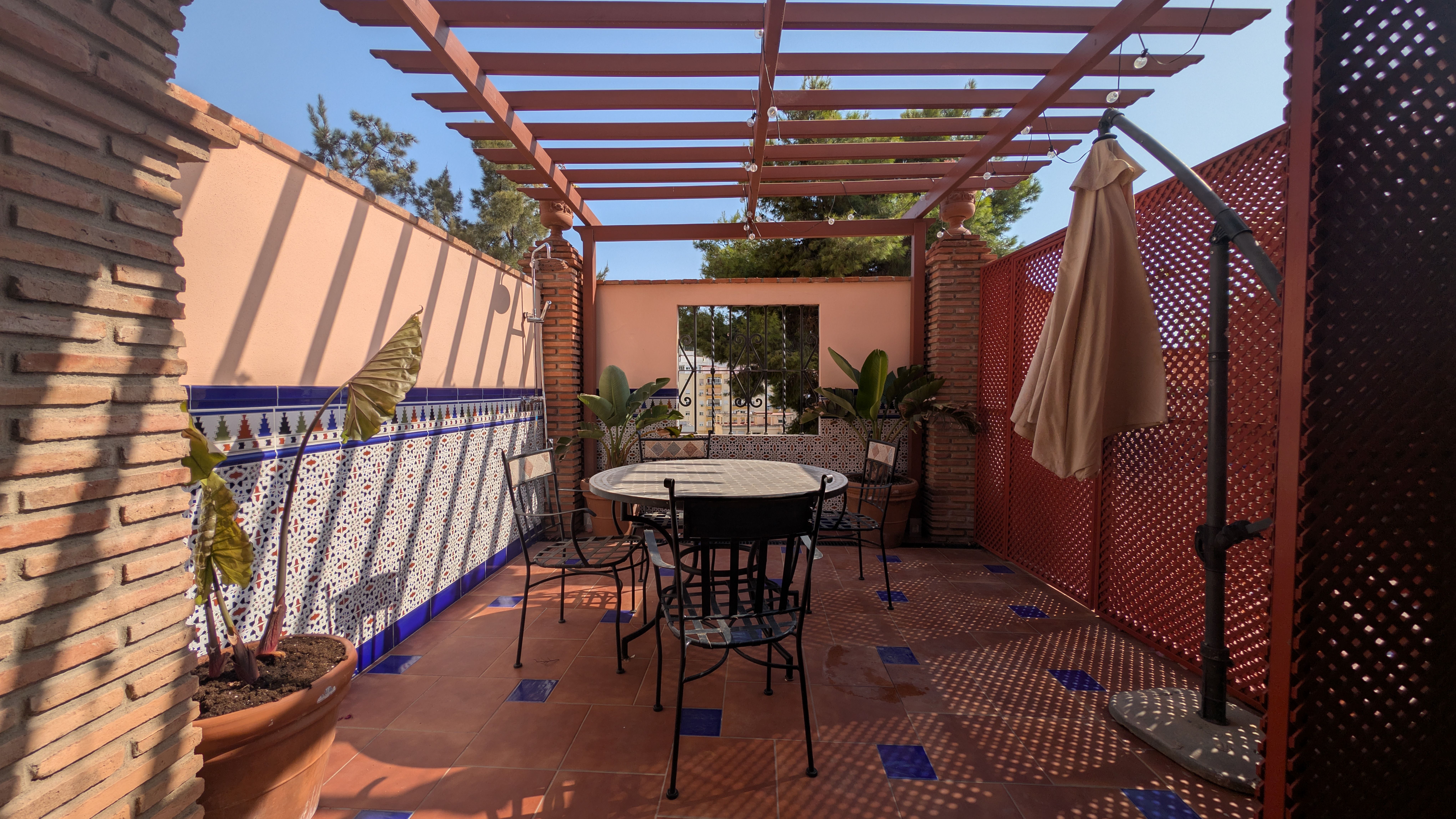 image Private terrace with an outdoor dining area and pergola, perfect for enjoying the Malaga sunshine.