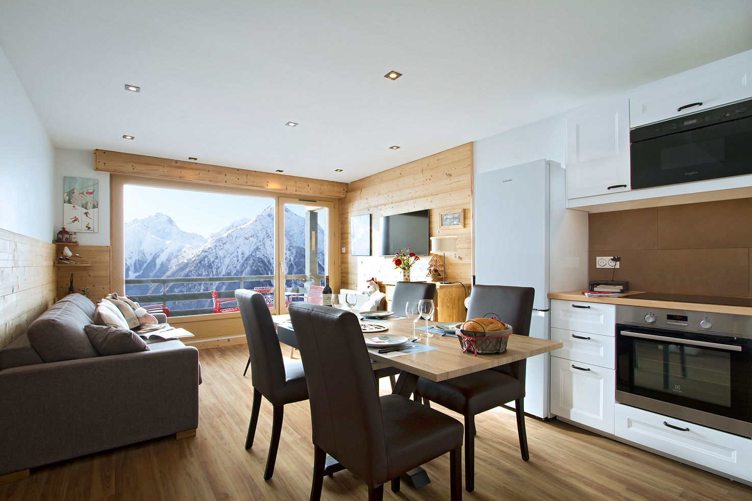 image Bright alpine living space with mountain views through picture windows