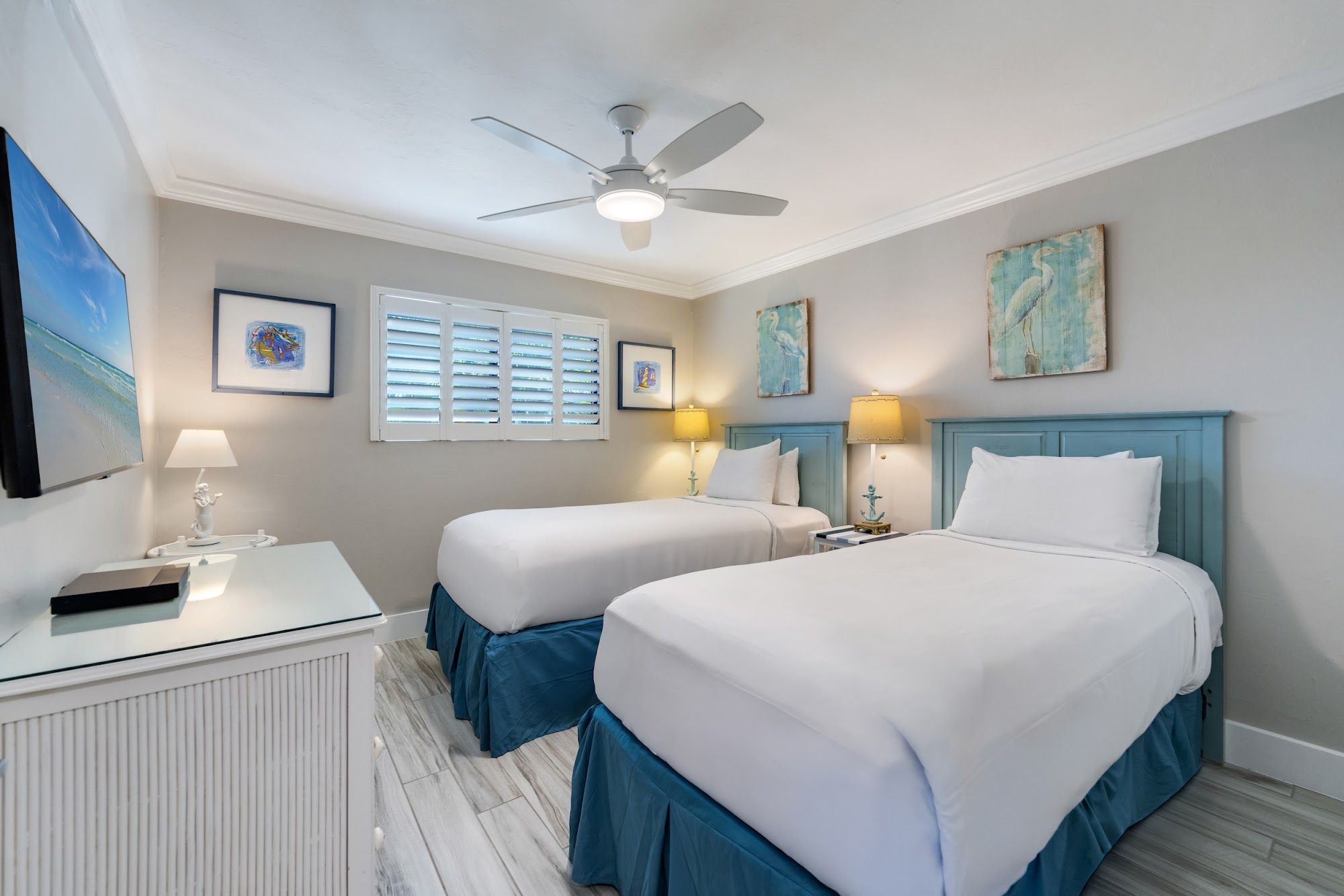 image Twin bedroom with white bedding and coastal accents