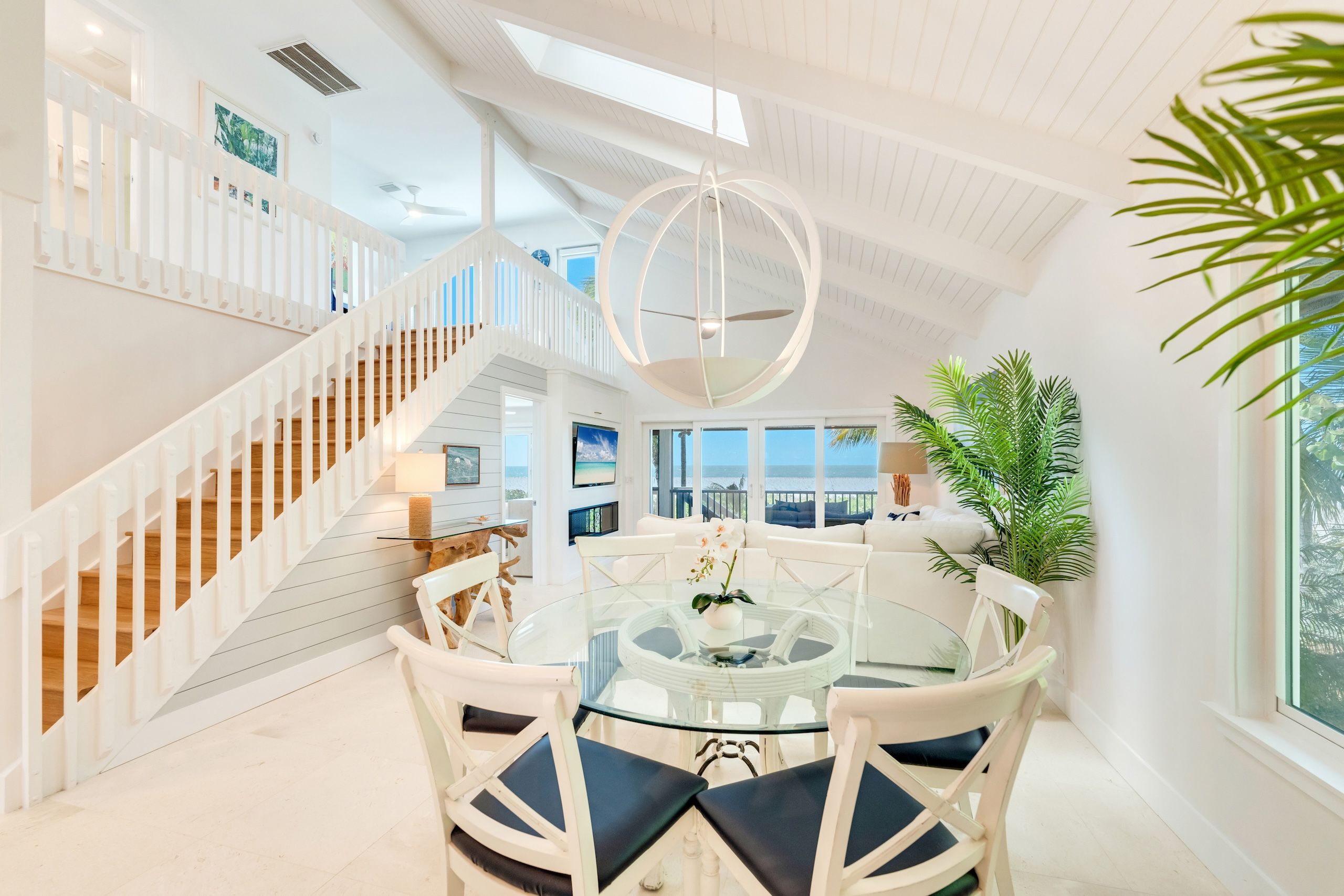 image Soft light fills the airy dining area, where the table invites shared meals and laughter.