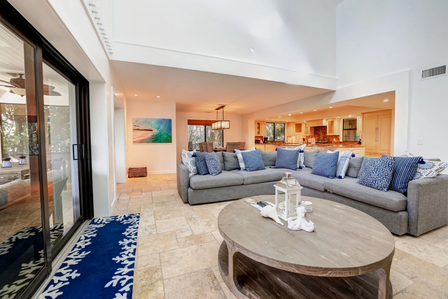 image Plush sofas adorned with vibrant pillows create a welcoming gathering space, perfectly blending comfort with coastal charm.