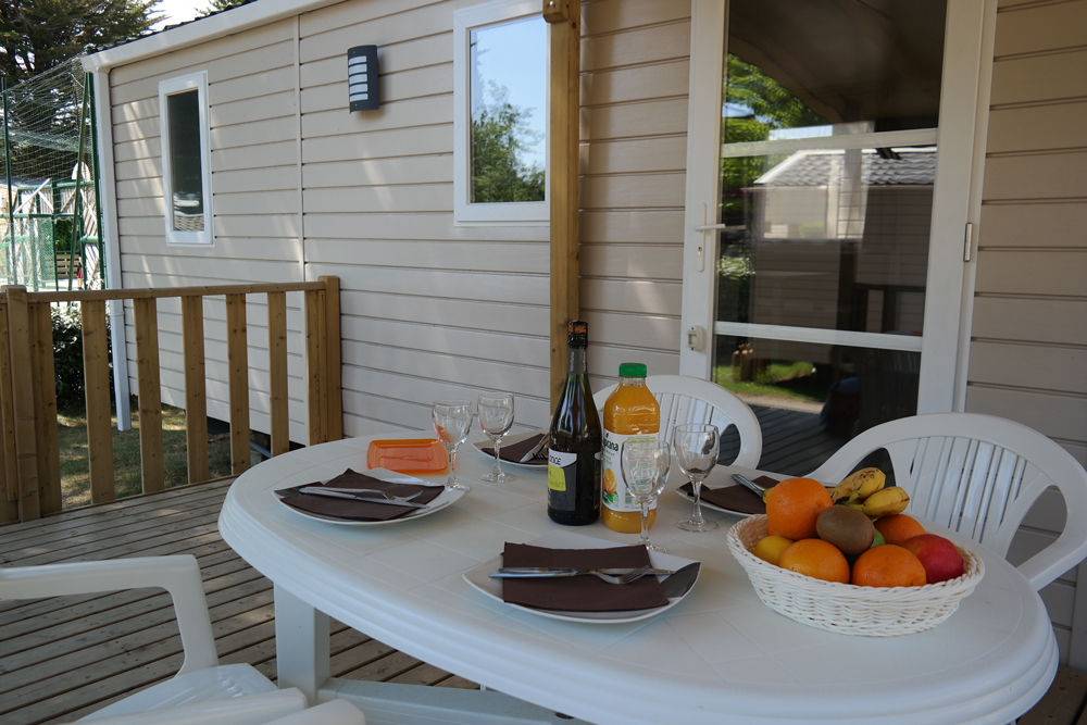 image The terrace dining table, set for a meal outdoors.
