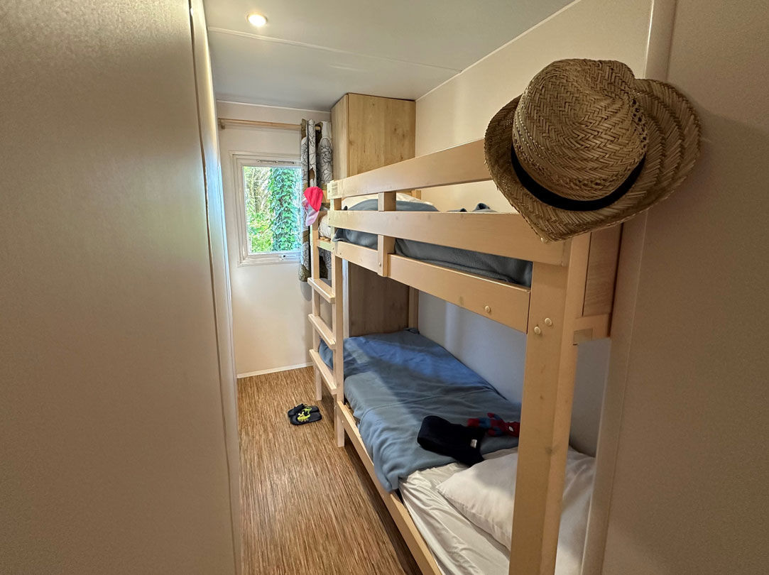 image The bunk bedroom, with natural light from the window.