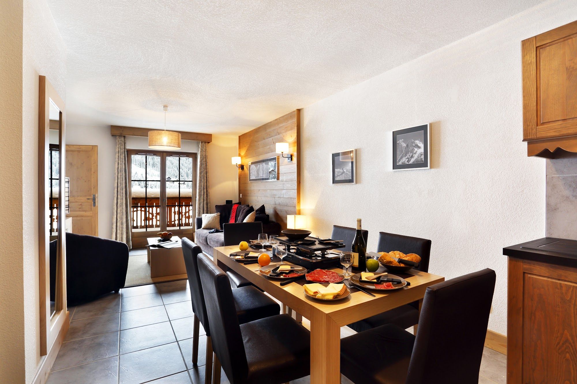 image Dining area with mountain-view windows and table settings