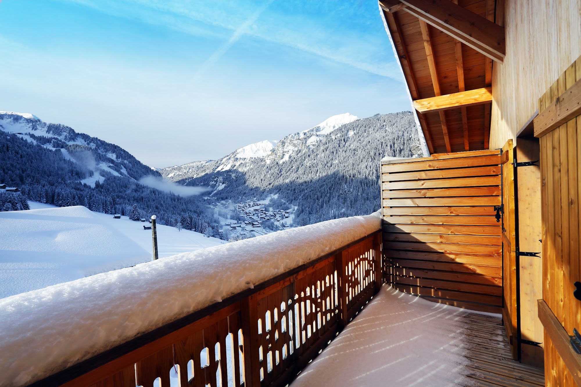 image Snow-covered wooden balcony with mountain view