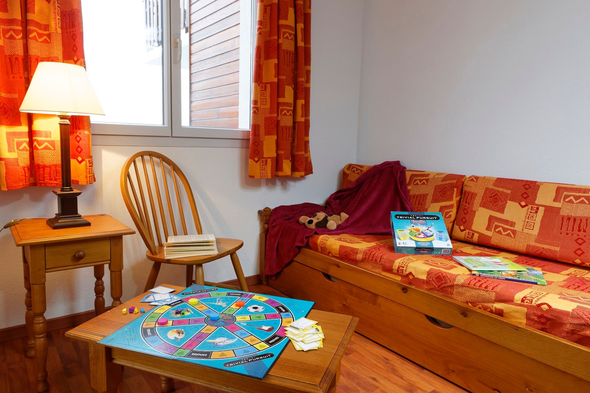 image A comfortable corner sets the scene for family games and downtime.