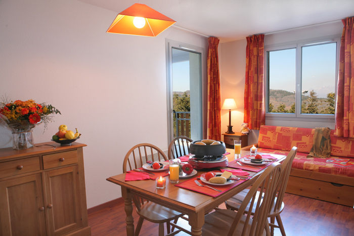 image Gather around the festive dining table for delightful meals and fondue nights.