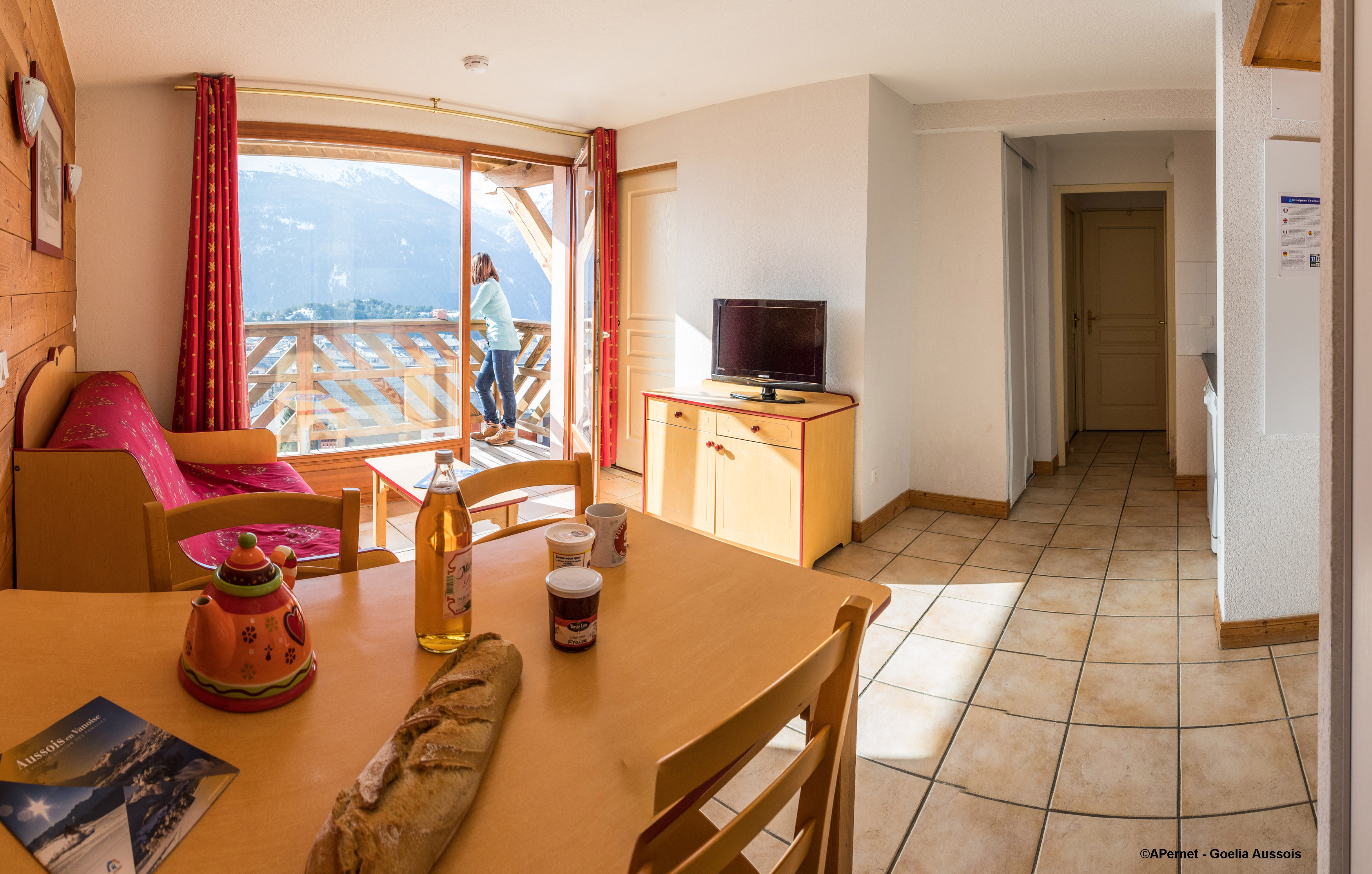 image Inviting living space with stunning mountain views from the balcony.