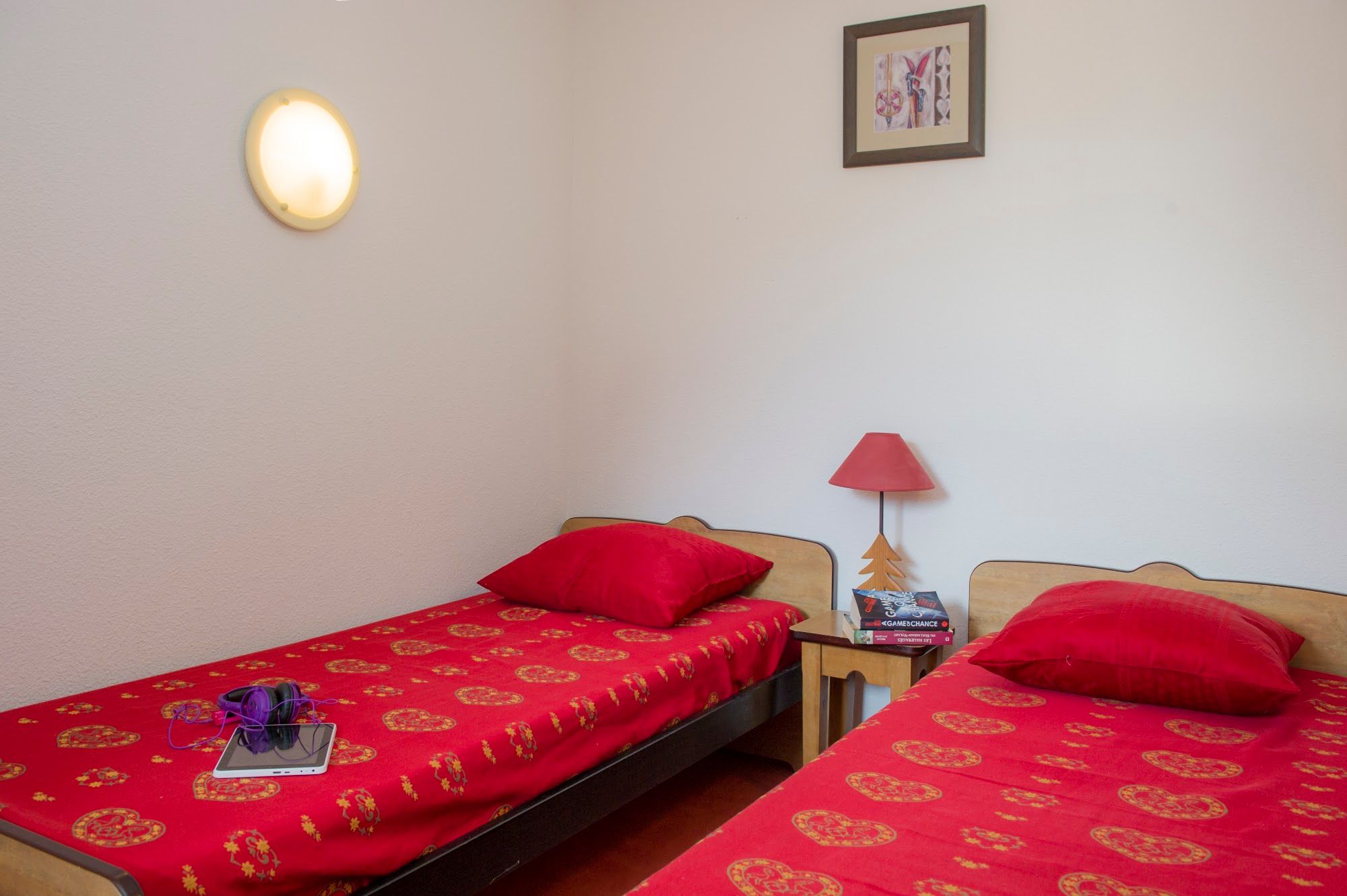 image Twin bedroom with two single beds and a shared bedside table.