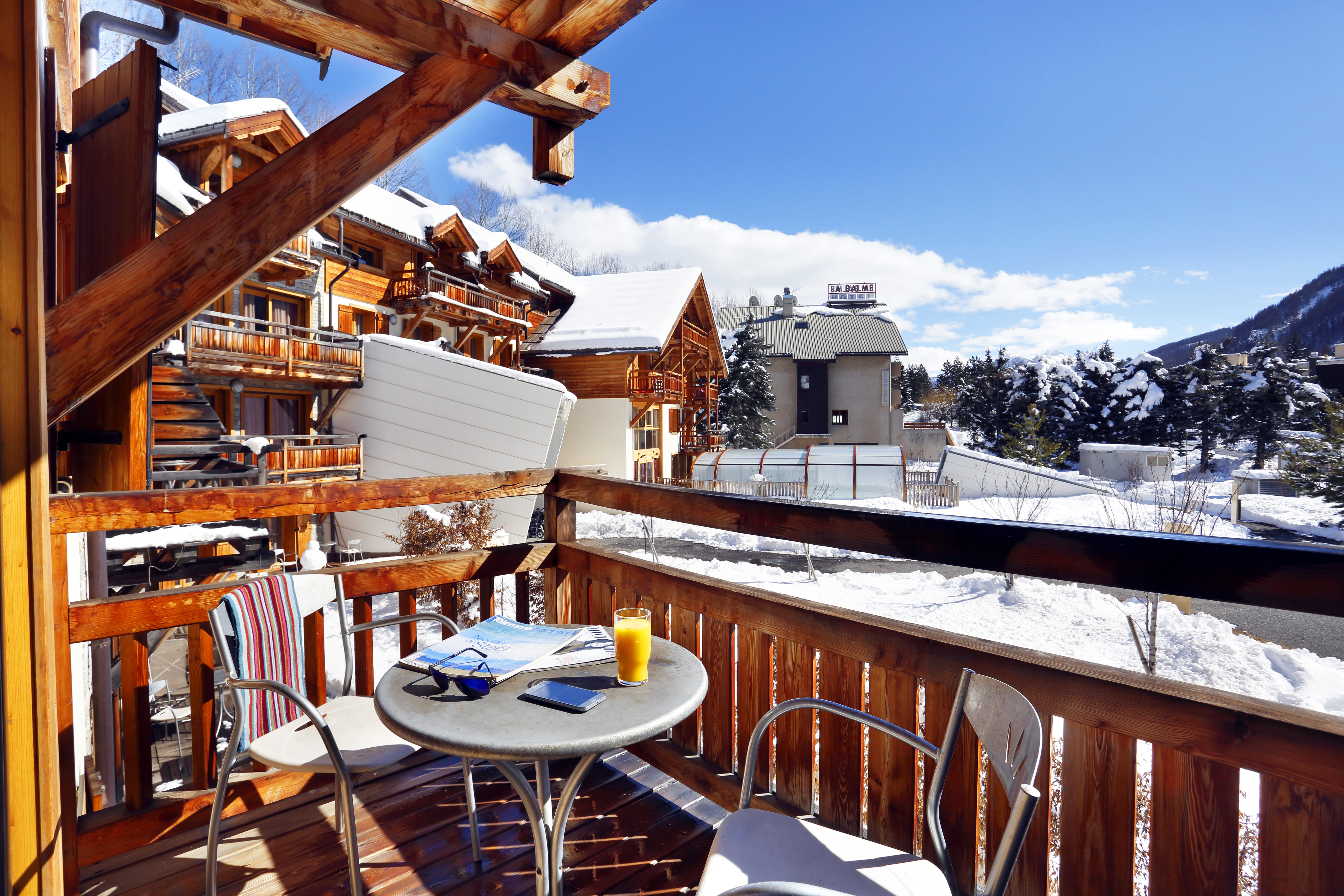image A winter wonderland awaits just beyond your cozy retreat's balcony.