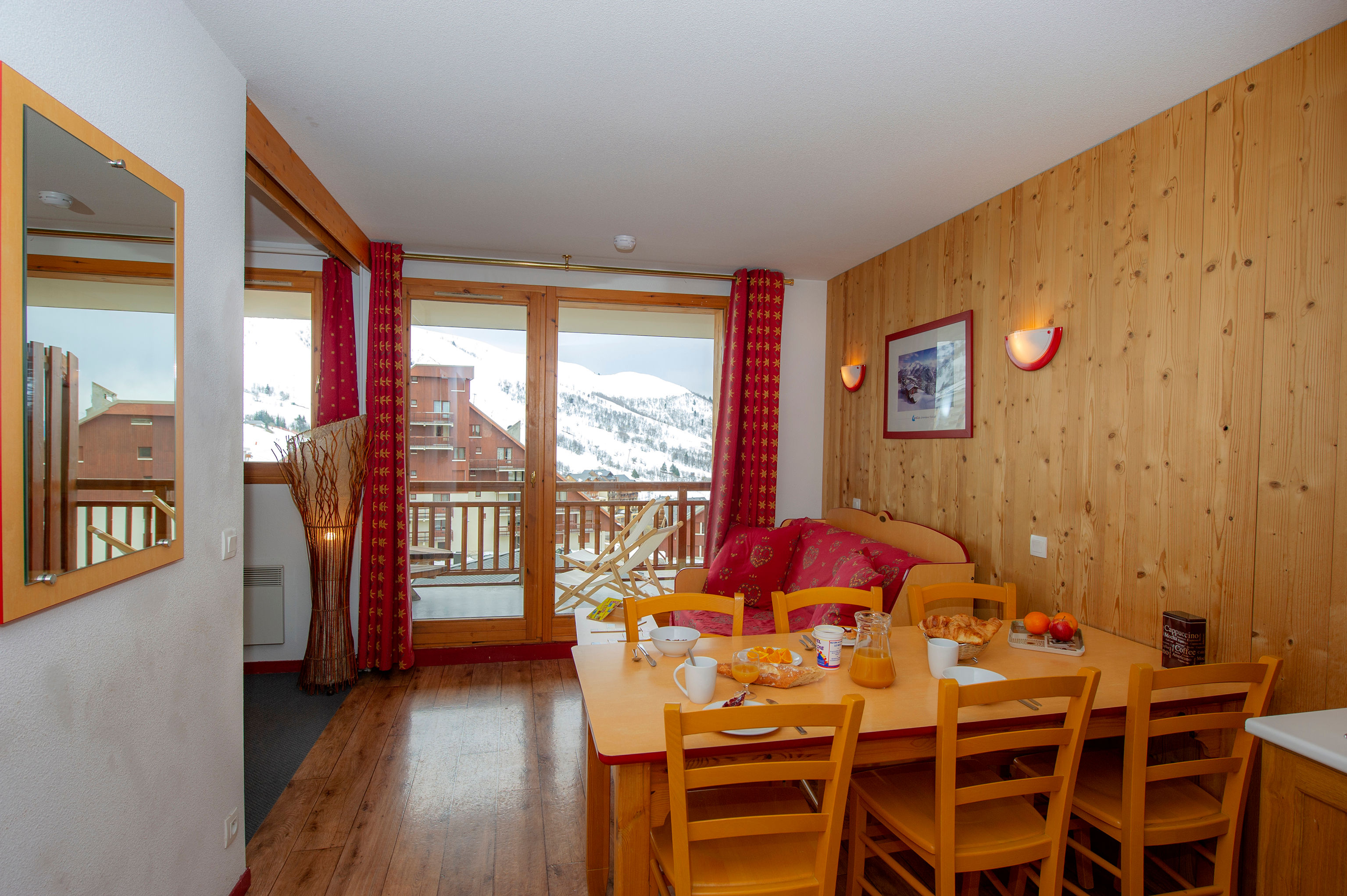 image Dining opens onto the balcony just beyond the living room.