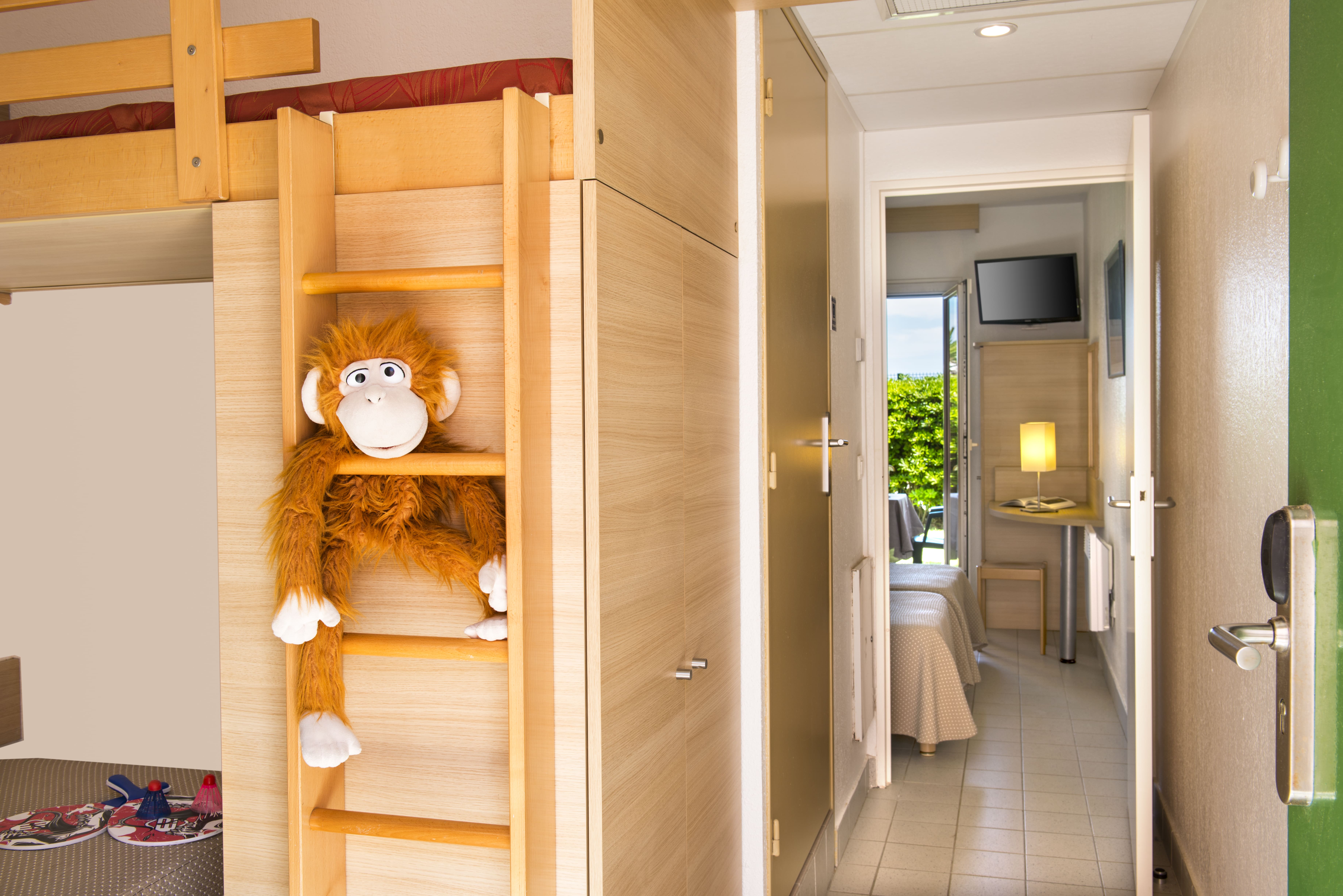 image Room entryway with a wooden ladder and toy.