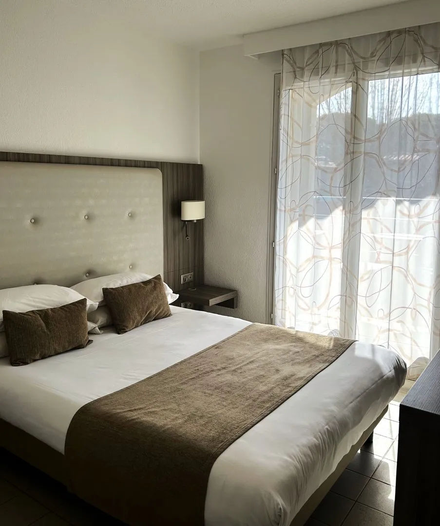 image Bedroom with double bed and window.