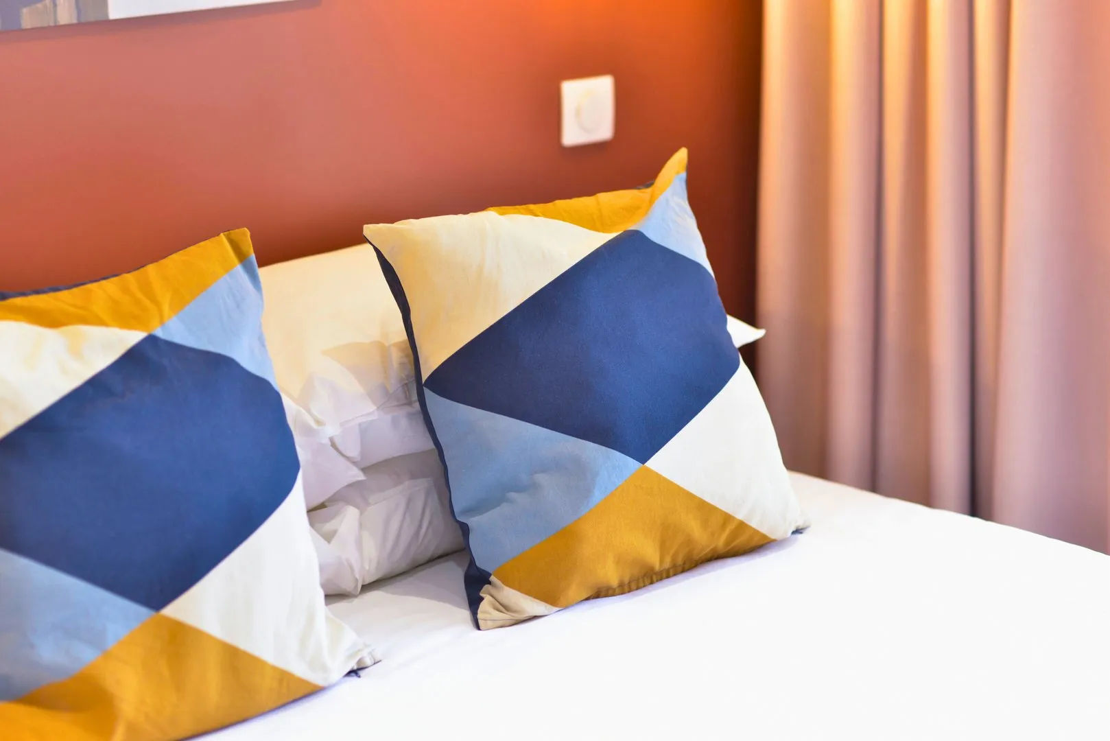 image Decorative pillows on a bed.