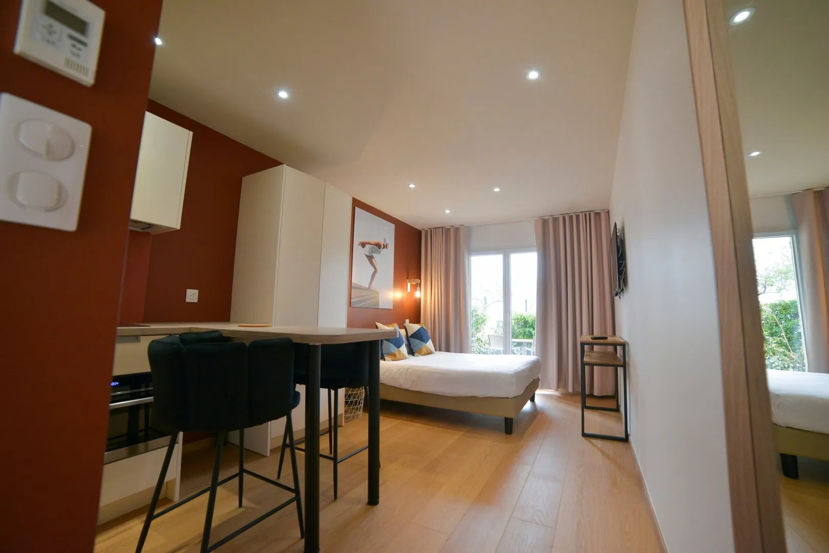 image Studio with kitchen area and dining table.