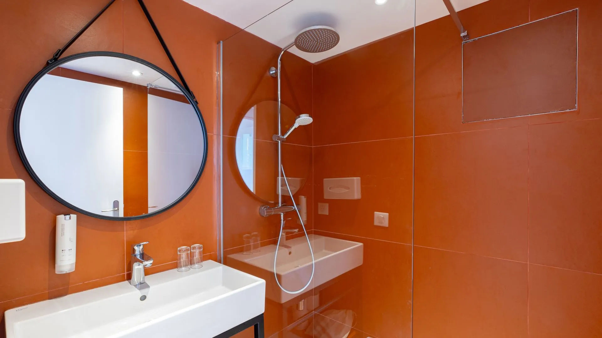 image Bathroom with large mirror and modern fixtures.
