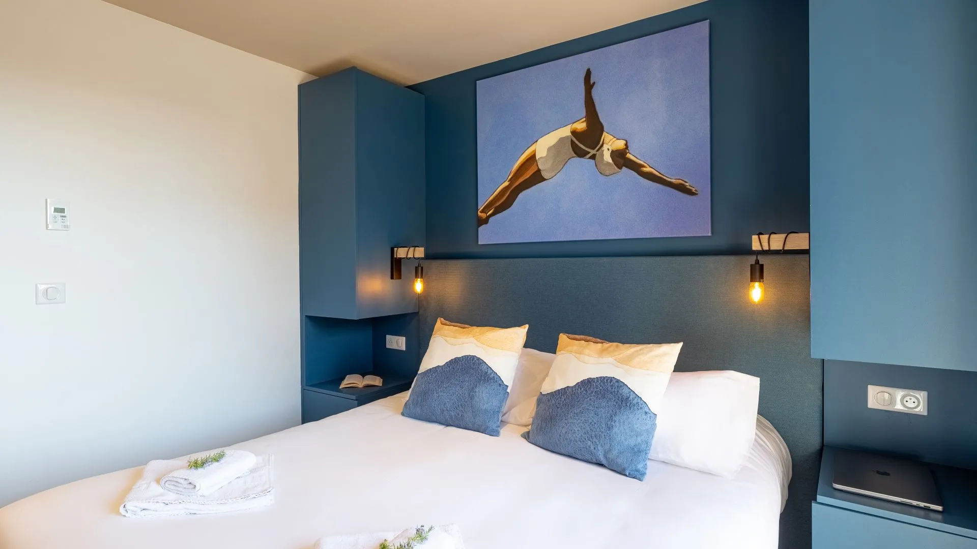 image Bedroom with large bed and blue decor.