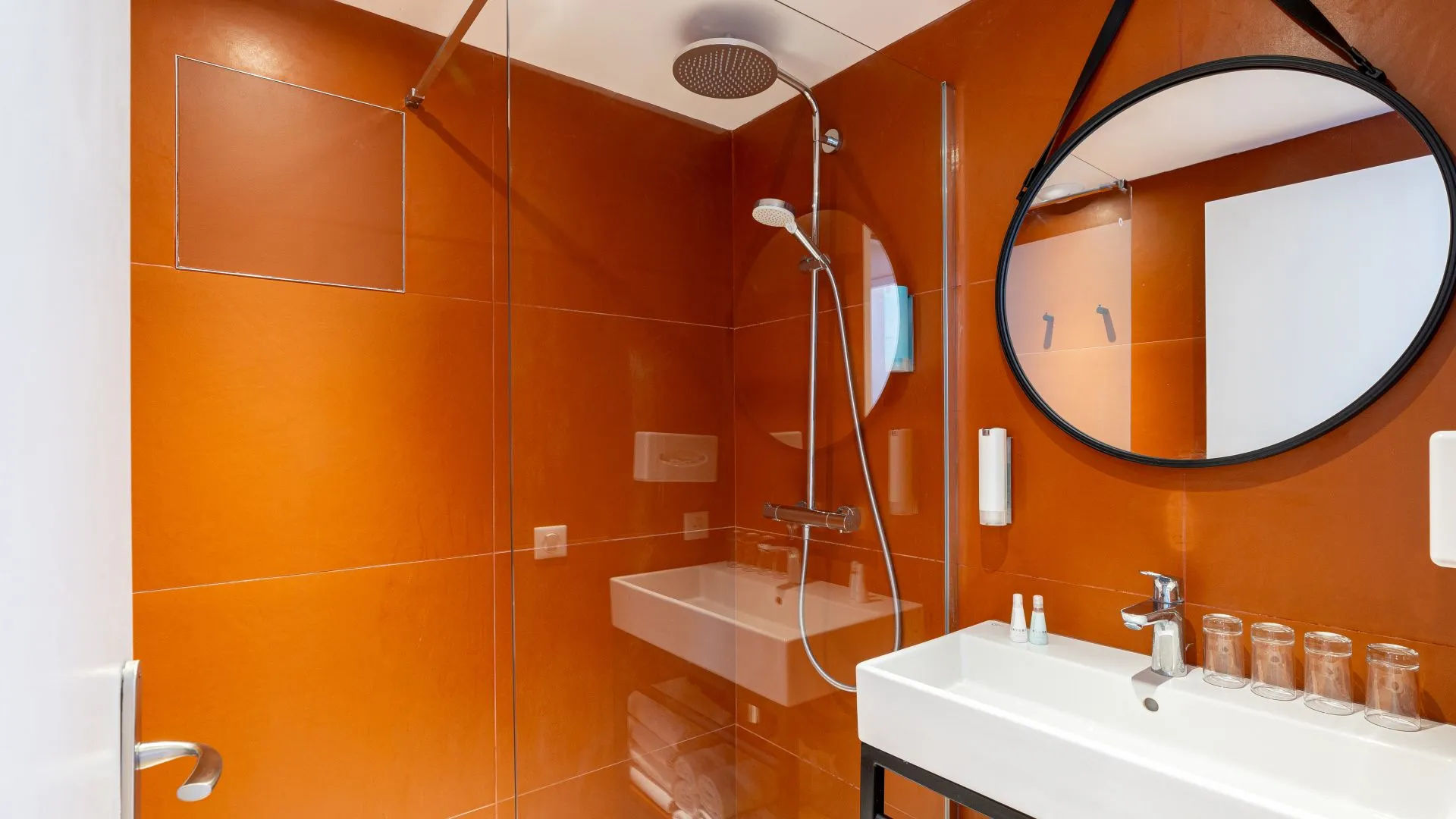 image Bathroom with tiled shower and modern fixtures.