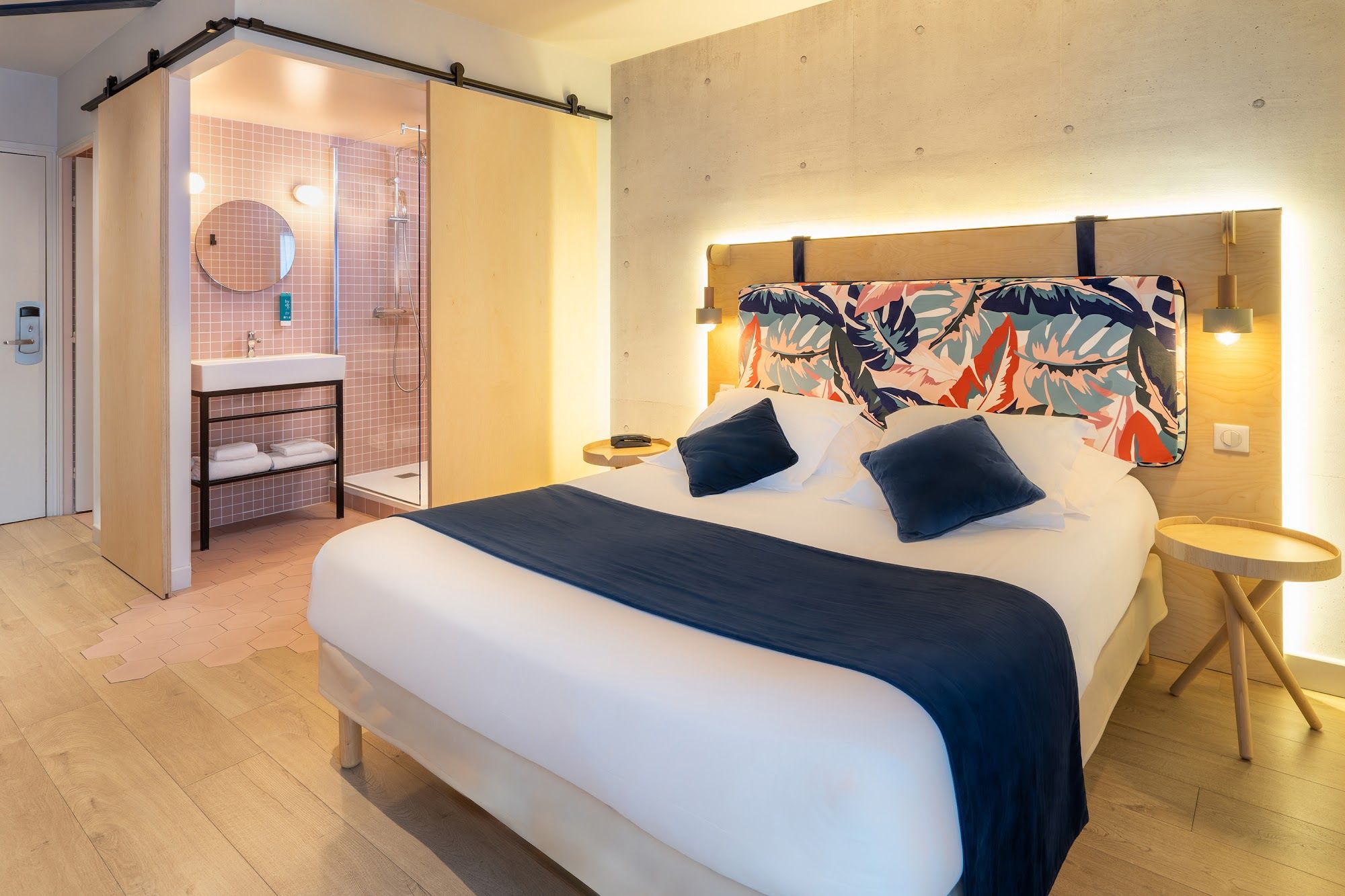 image Room with a double bed and bathroom visible in the background