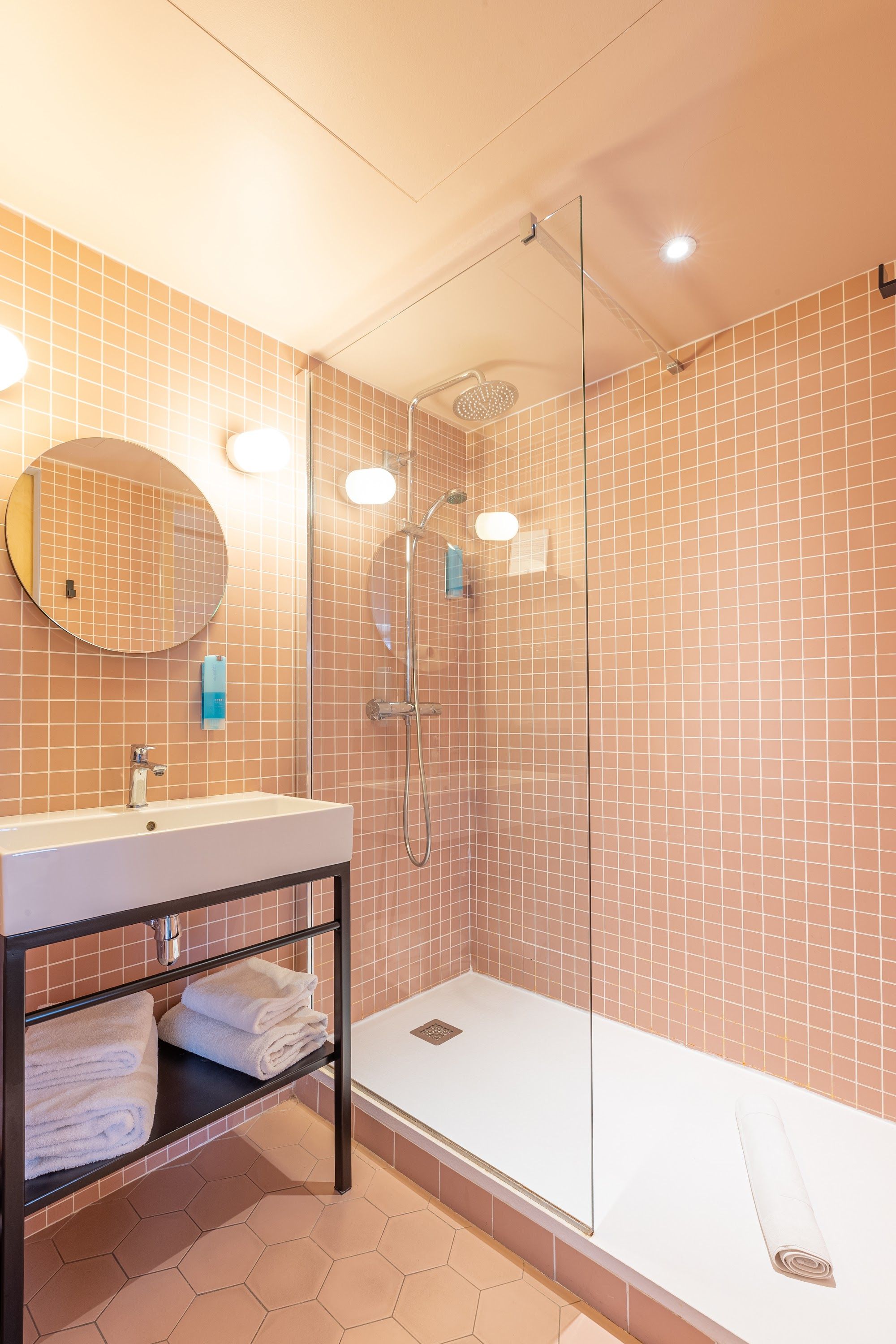 image Pink tiled bathroom with shower enclosure and wall mirror