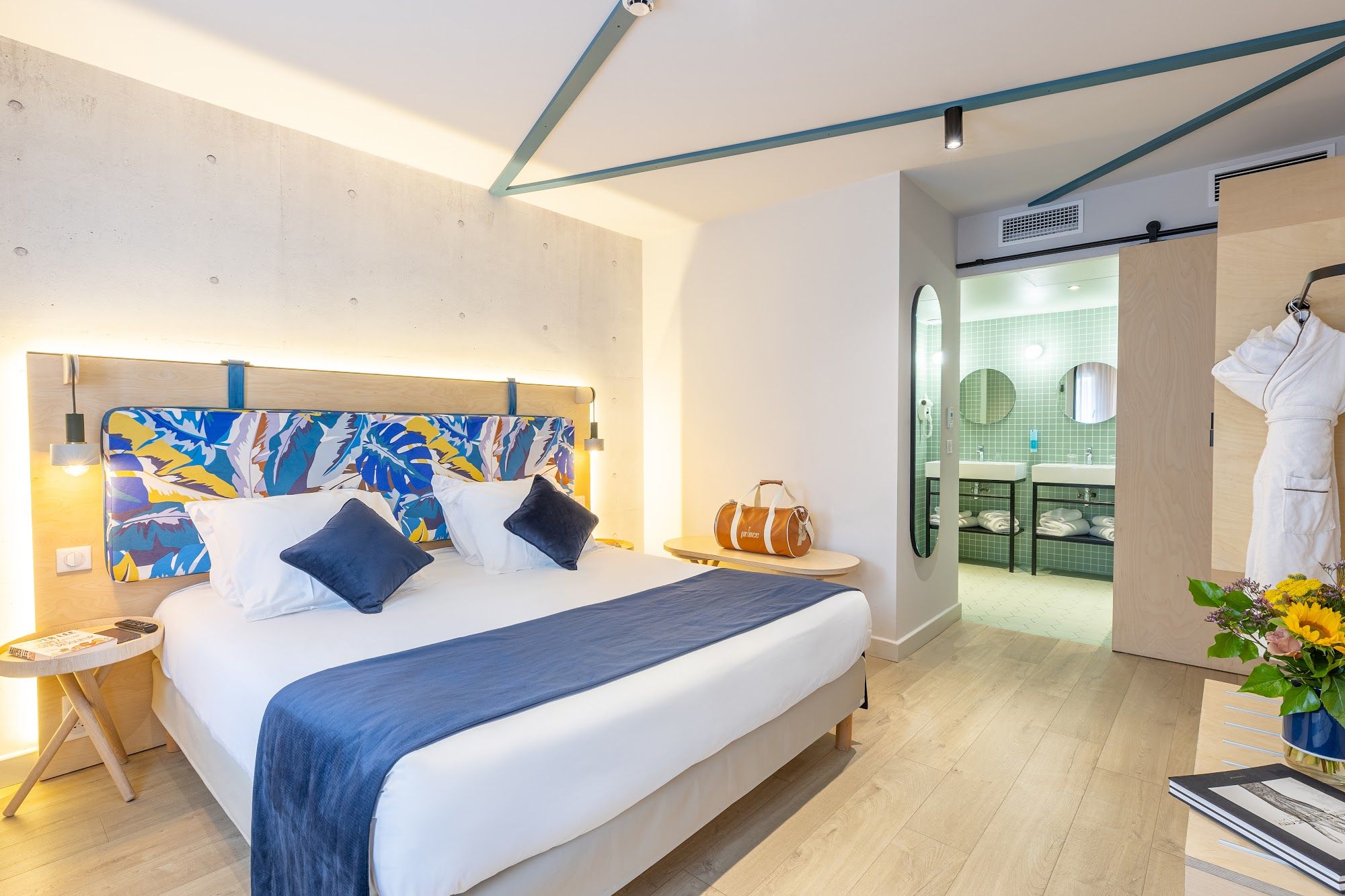 image Suite bedroom with a bed, seating area, and bathroom access