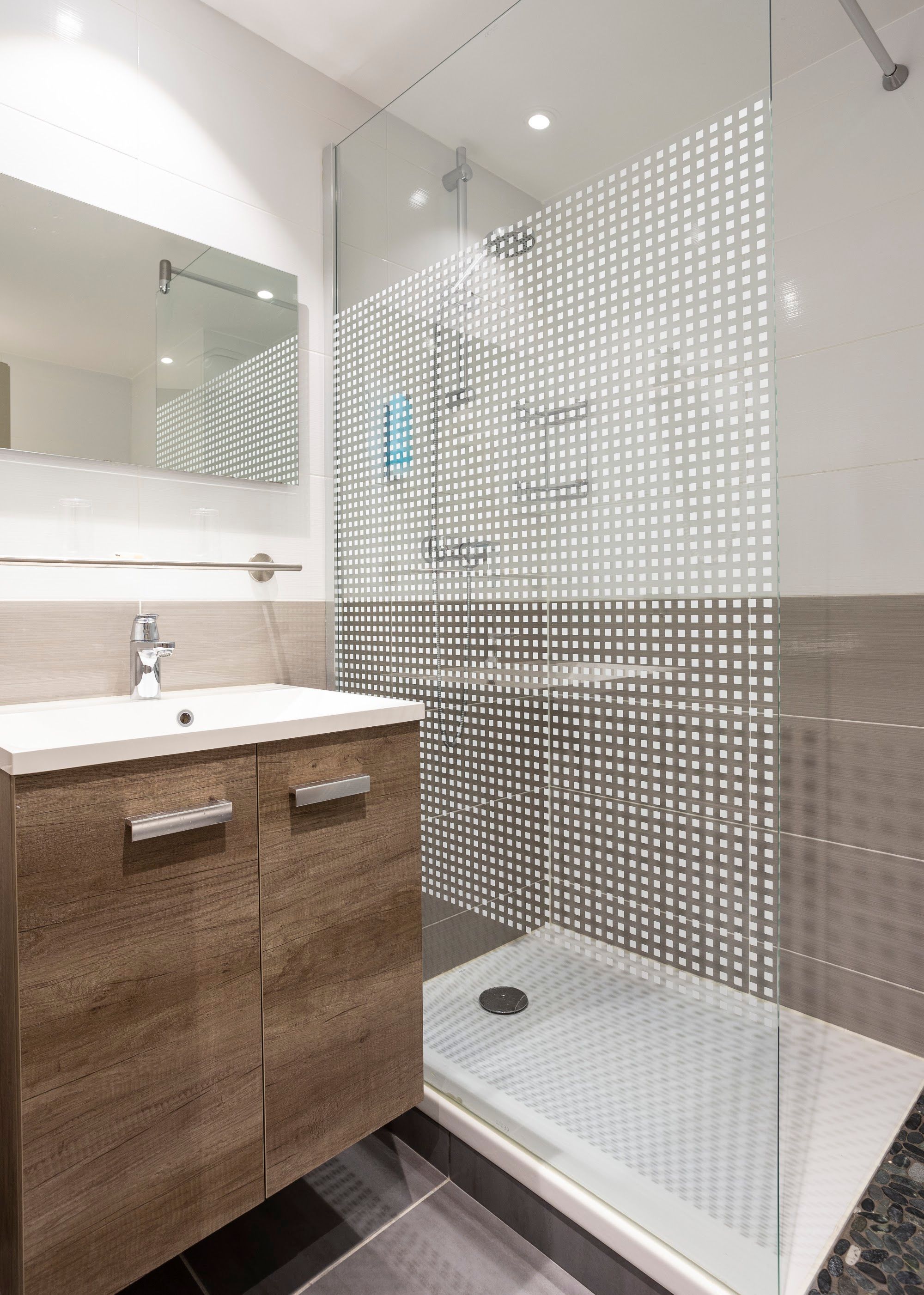 image Bathroom with walk-in shower, sink, and mirror cabinet