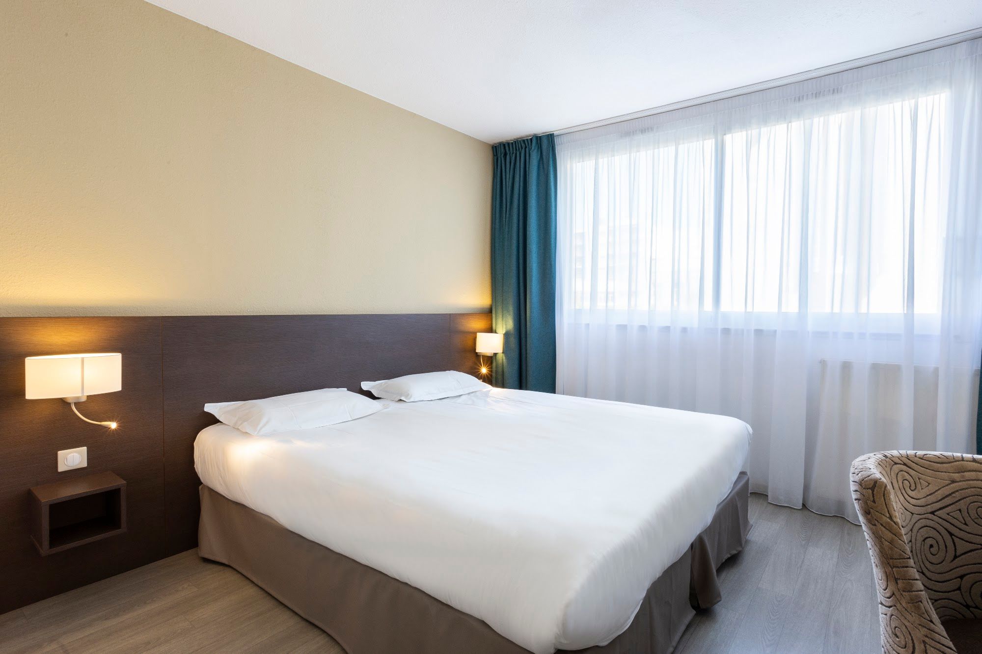 image Bedroom with double bed, lamp, and window