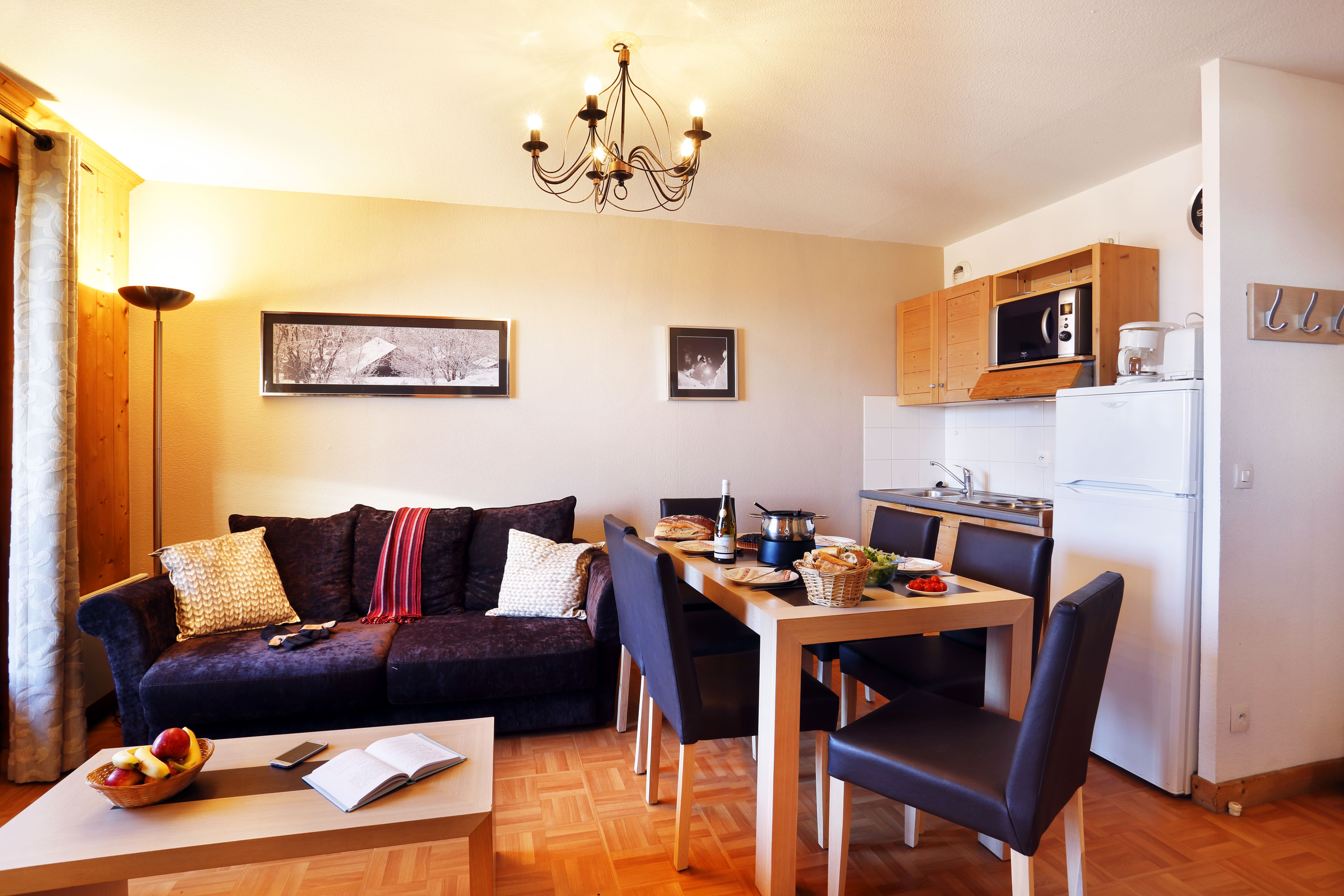 image Modern living area with kitchenette.