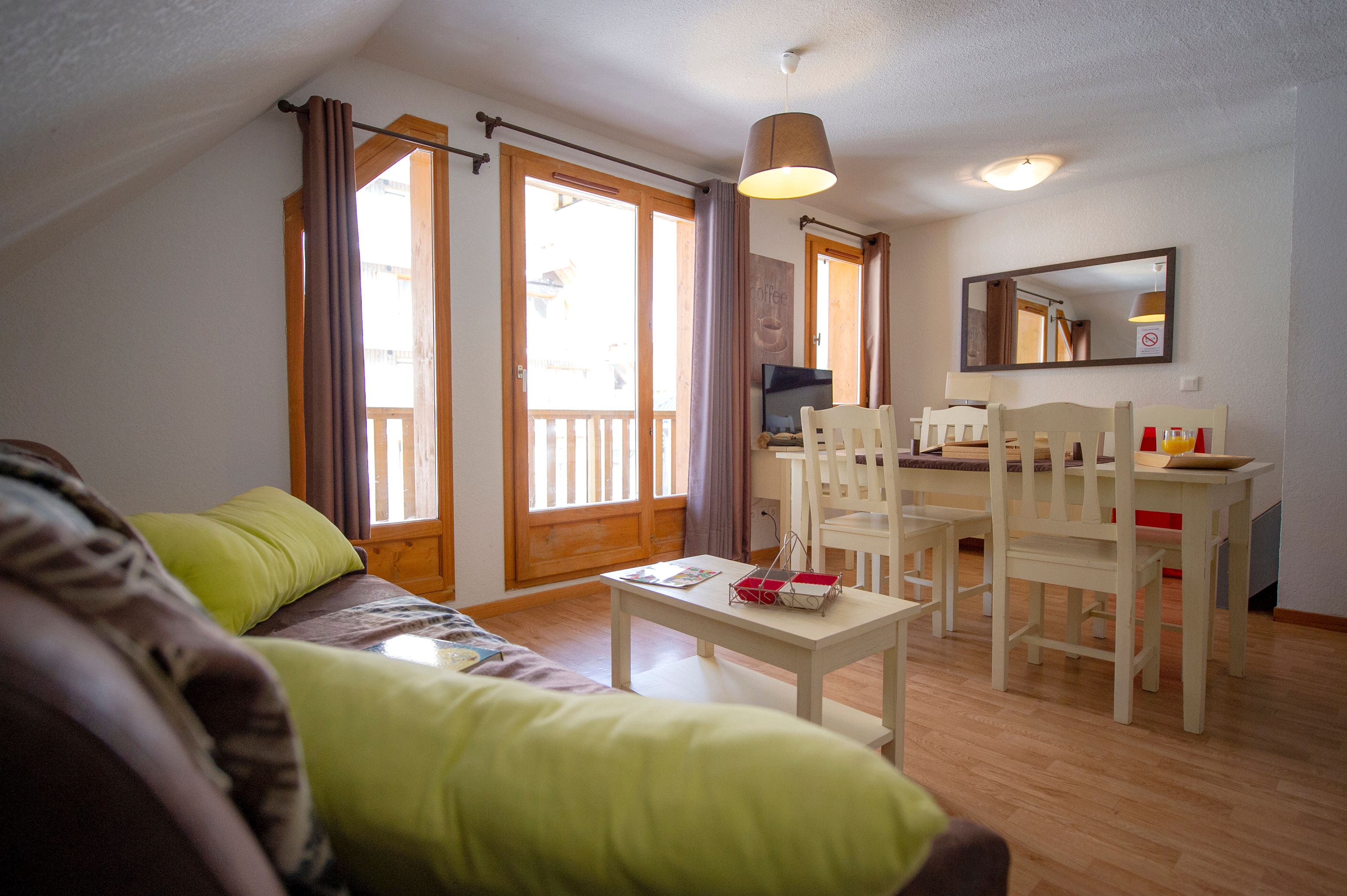 image Natural light fills the living area through large windows.