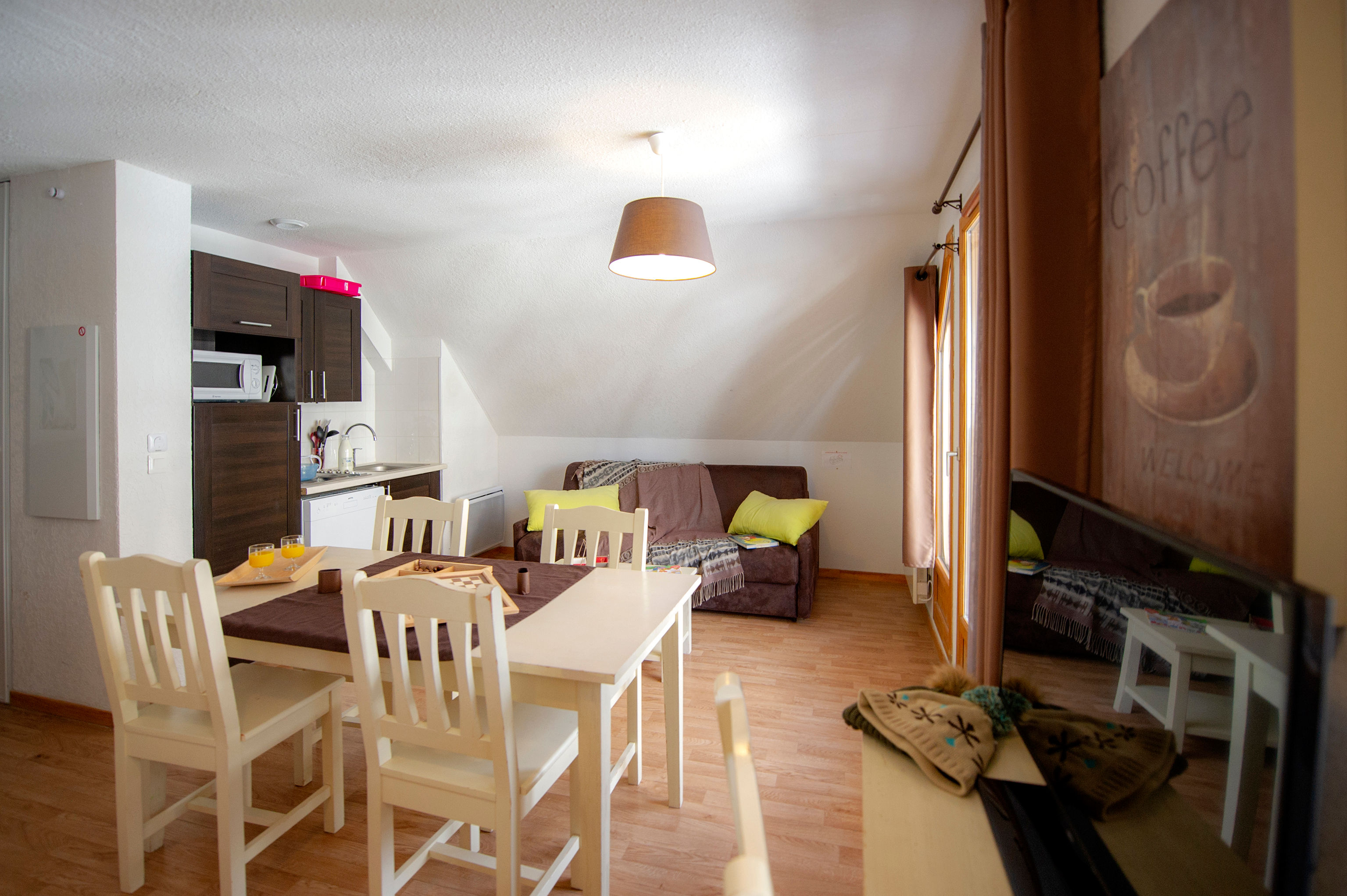 image Yellow cushions brighten the living room sofa.