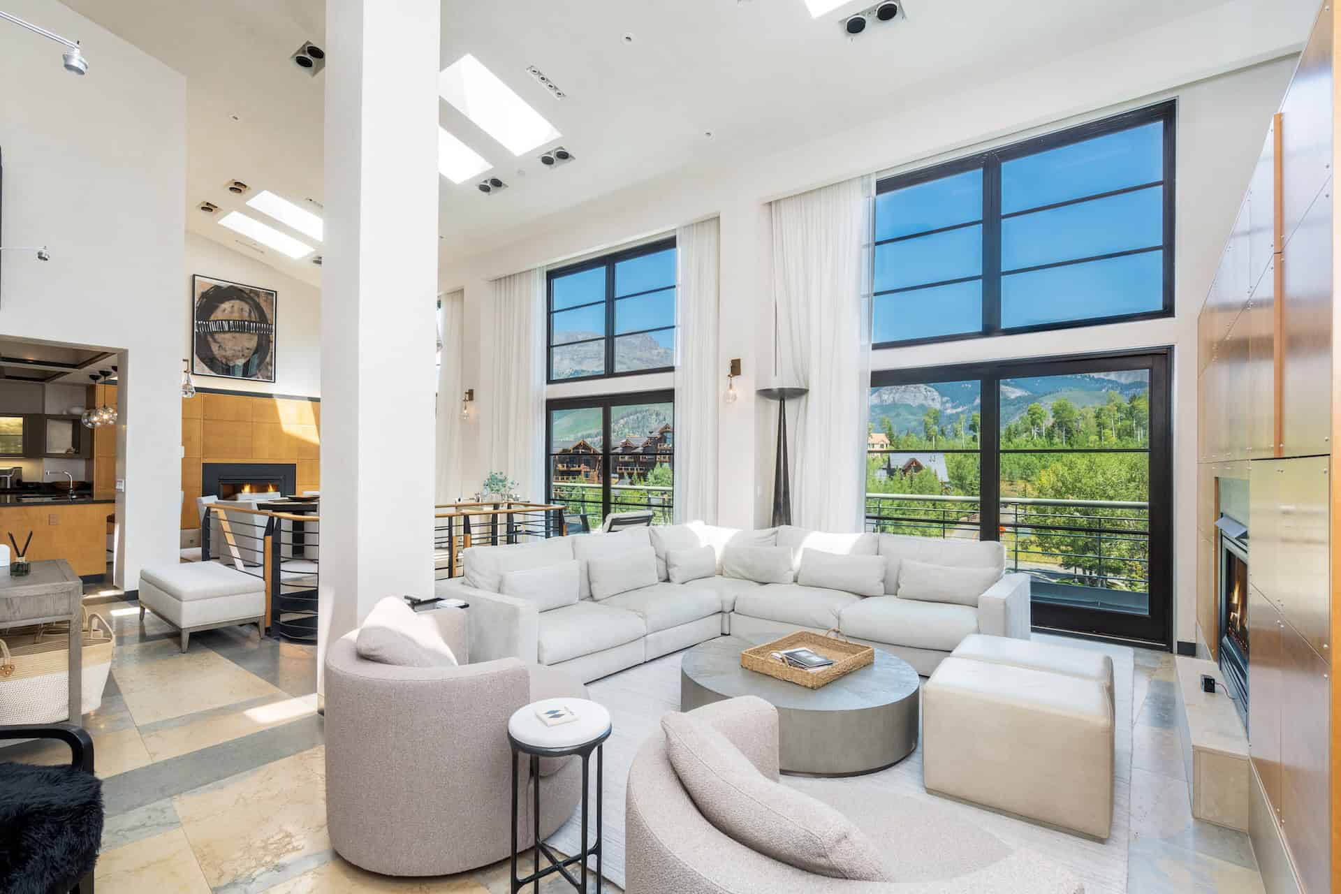 image Bright living room with sectional sofa and large windows