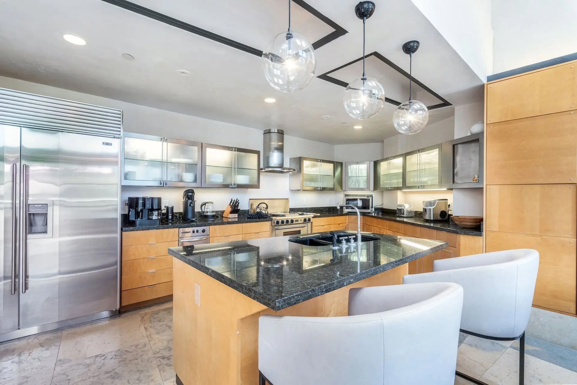 image Contemporary kitchen with stainless appliances and an island